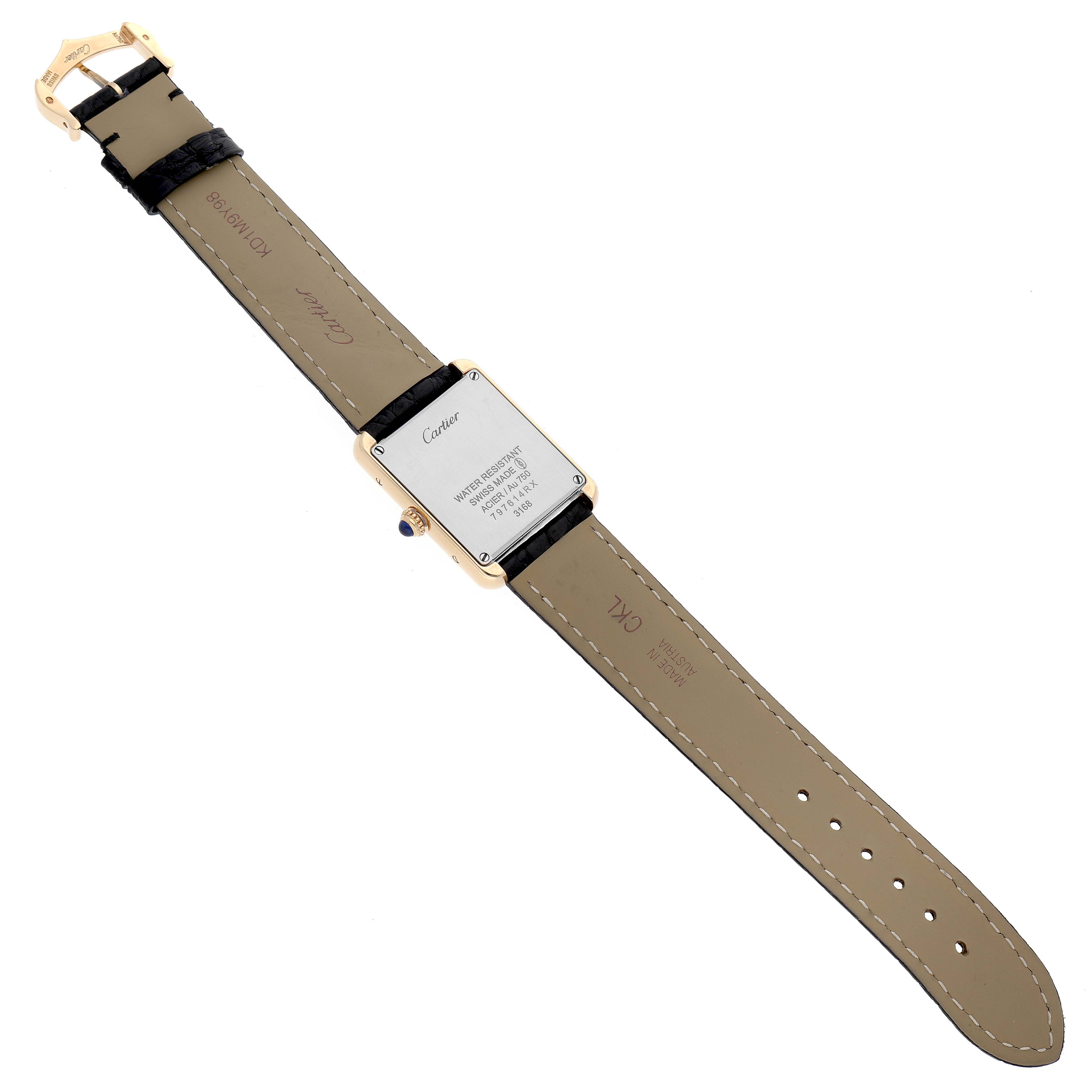 The image shows the back view of the Tank Solo model by Cartier, highlighting the strap, clasp, and case back.