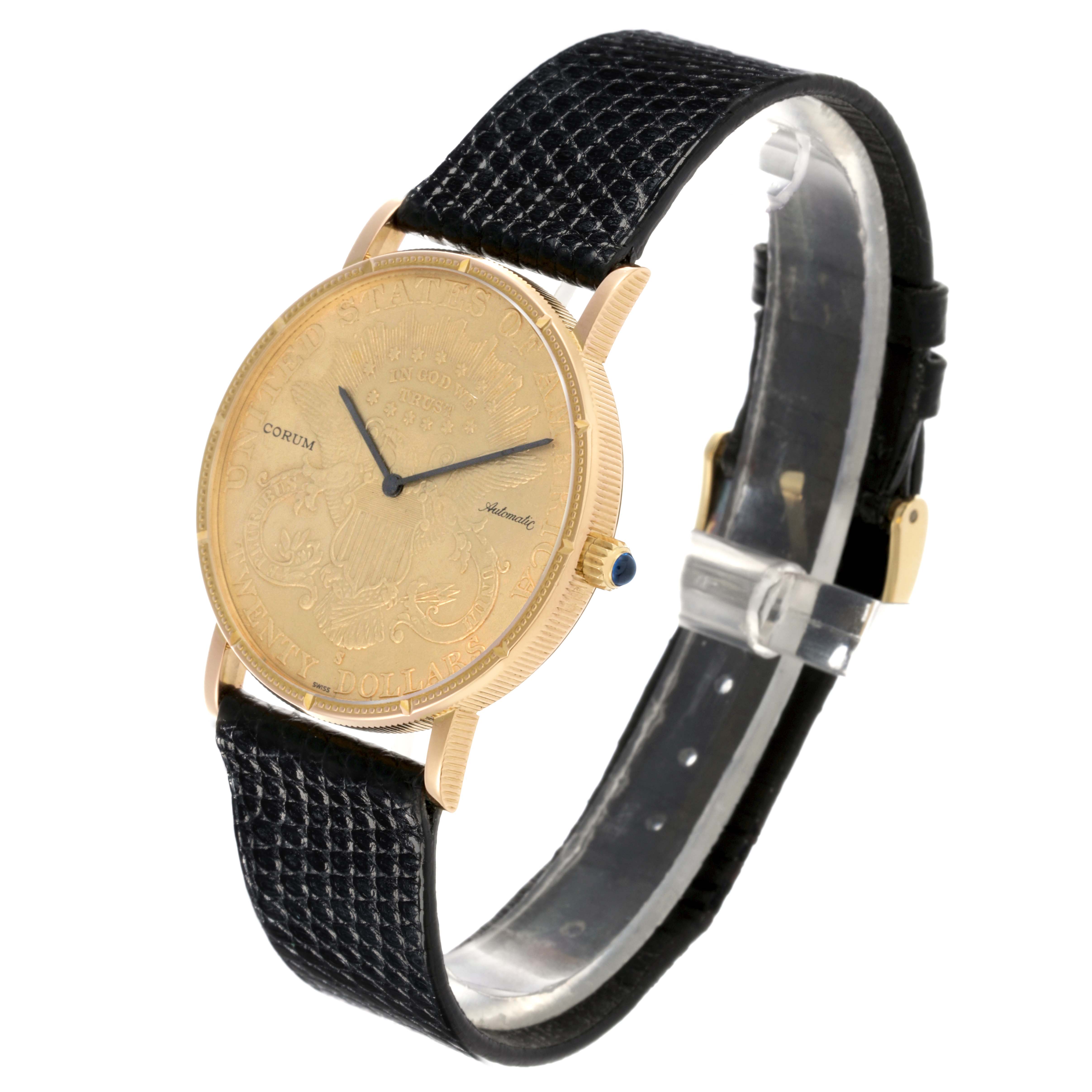 The Corum Coin Watch Men's Yellow Gold Champagne Dial Men's Yellow Gold Champagne Dial model is shown at a slight angle, highlighting the gold face, black strap, and side profile.