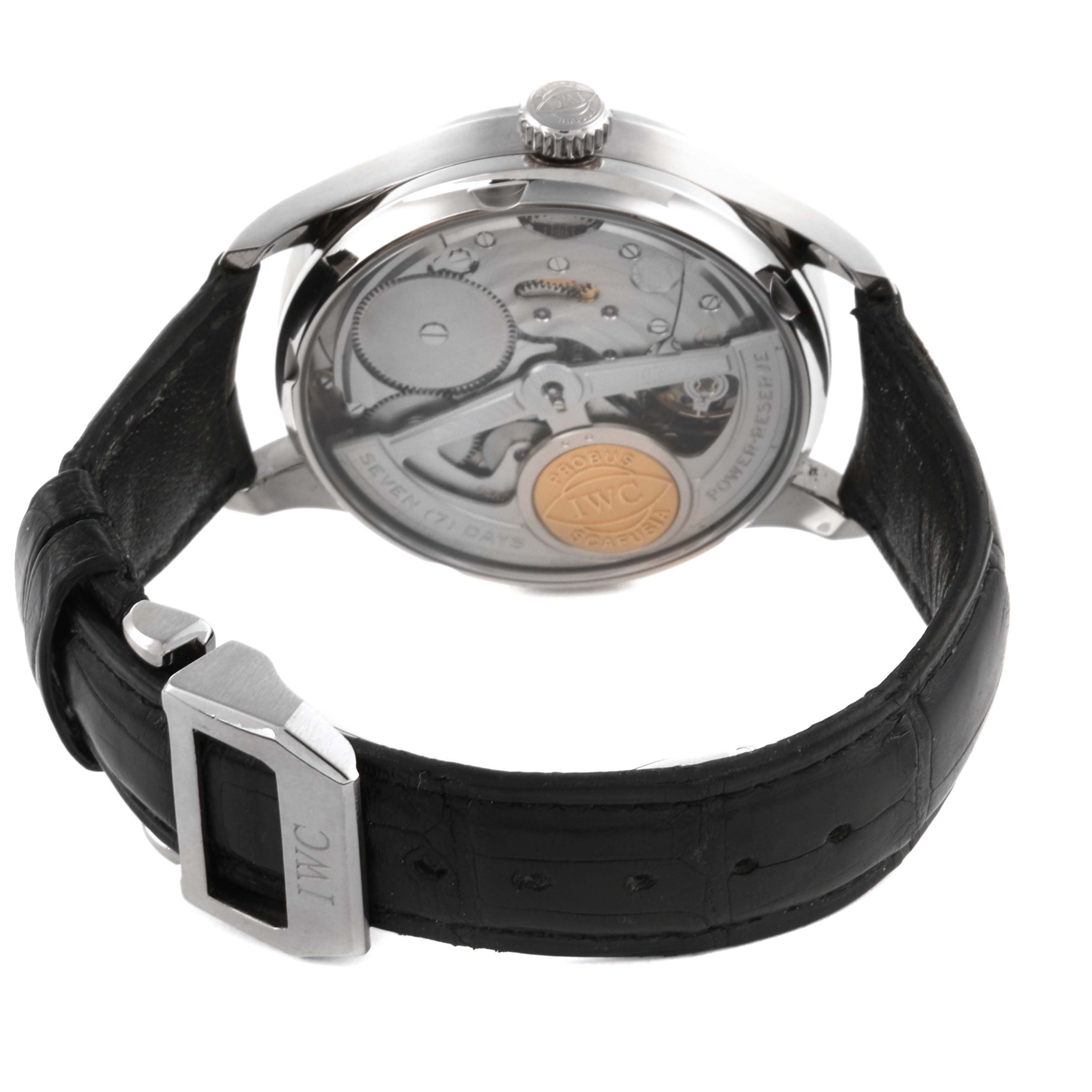 The IWC Portuguese IW500106 Men's White Gold Grey Dial IW500106 Men's White Gold Grey Dial watch is shown from a rear angle, highlighting the movement and strap with brand engraving.