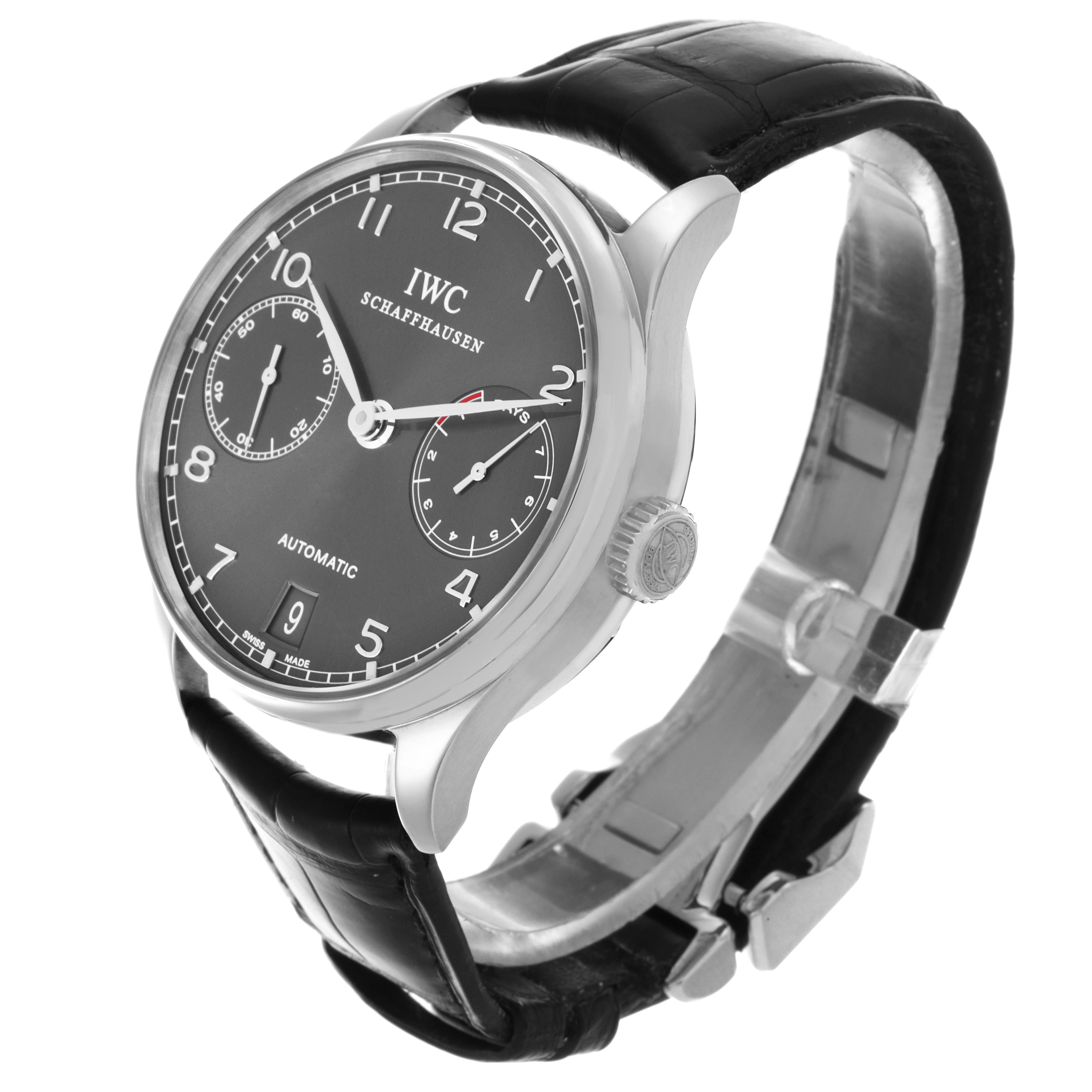 The IWC Portuguese IW500106 Men's White Gold Grey Dial IW500106 Men's White Gold Grey Dial watch is shown at an oblique angle, displaying the face, crown, and part of the leather strap.