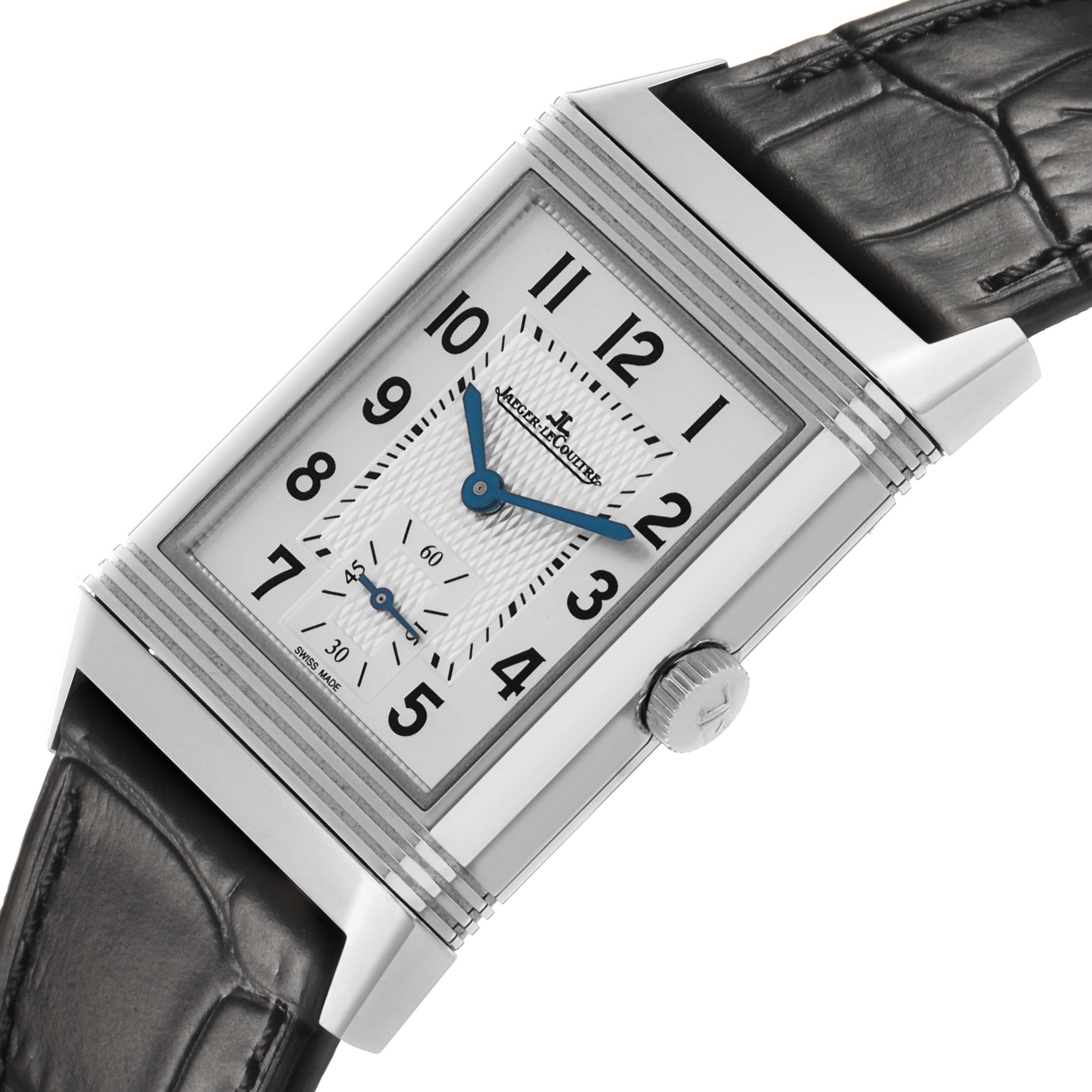 The Jaeger-LeCoultre Reverso watch is shown at an angled side view, highlighting the dial, case, and crown.