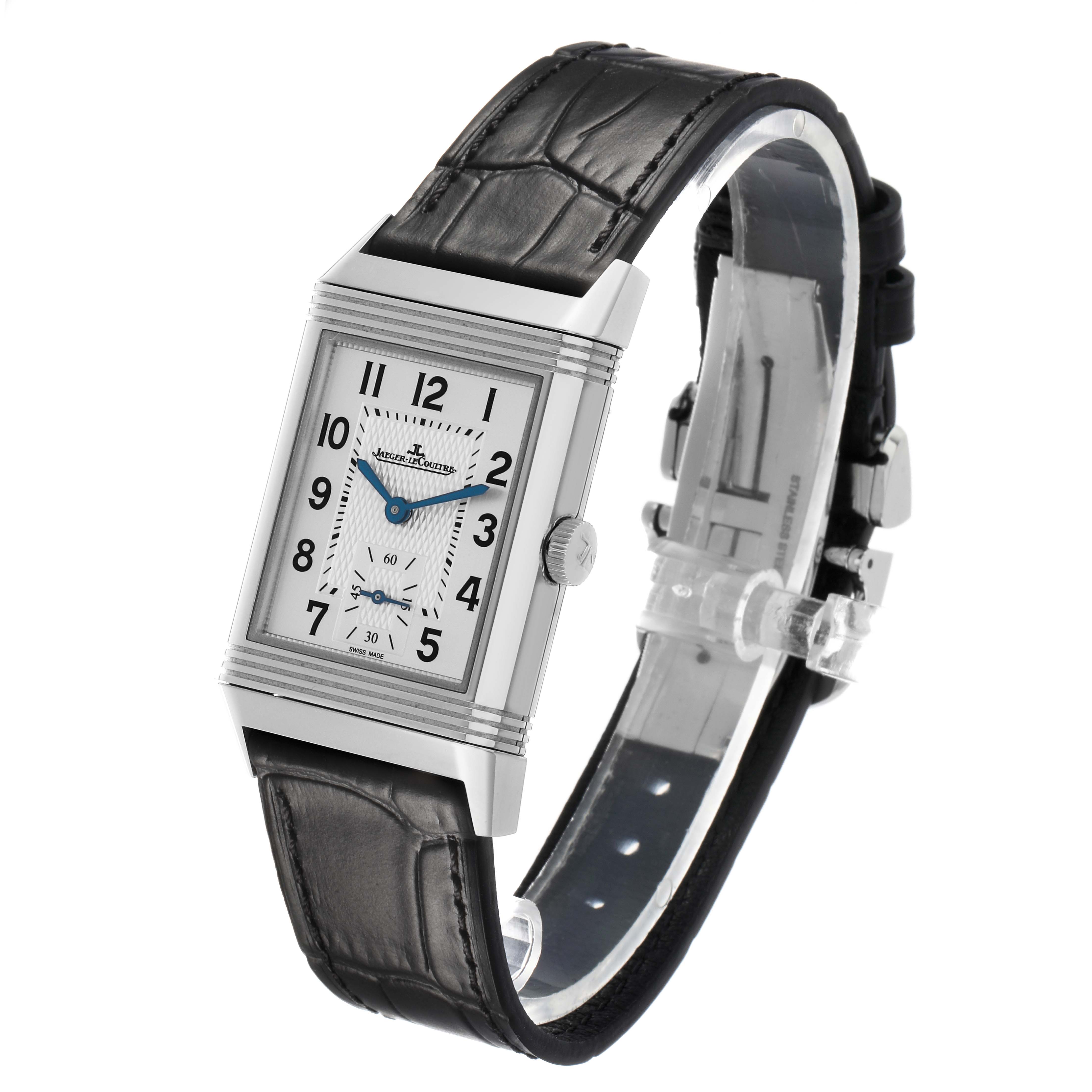 The Jaeger LeCoultre Reverso Q2458422 Men's Stainless Steel Silver Dial watch is shown at a slight angle, highlighting the rectangular face, strap, and side crown.