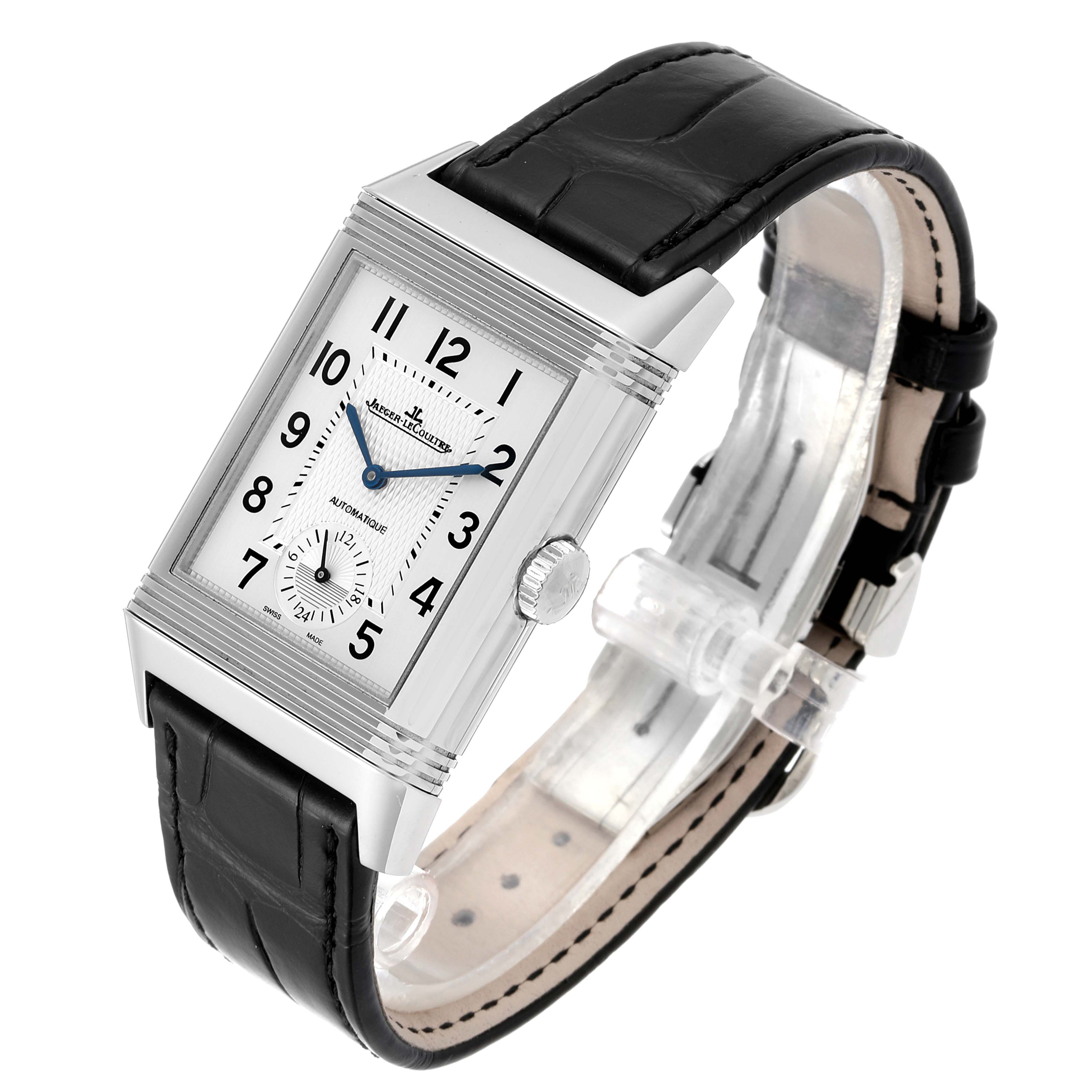 The image shows a Jaeger LeCoultre Reverso Q3838420 Men
s Stainless Steel Silver Dial Q3838420 Men
s Stainless Steel Silver Dial watch at an oblique angle, highlighting its rectangular dial and black leather strap.