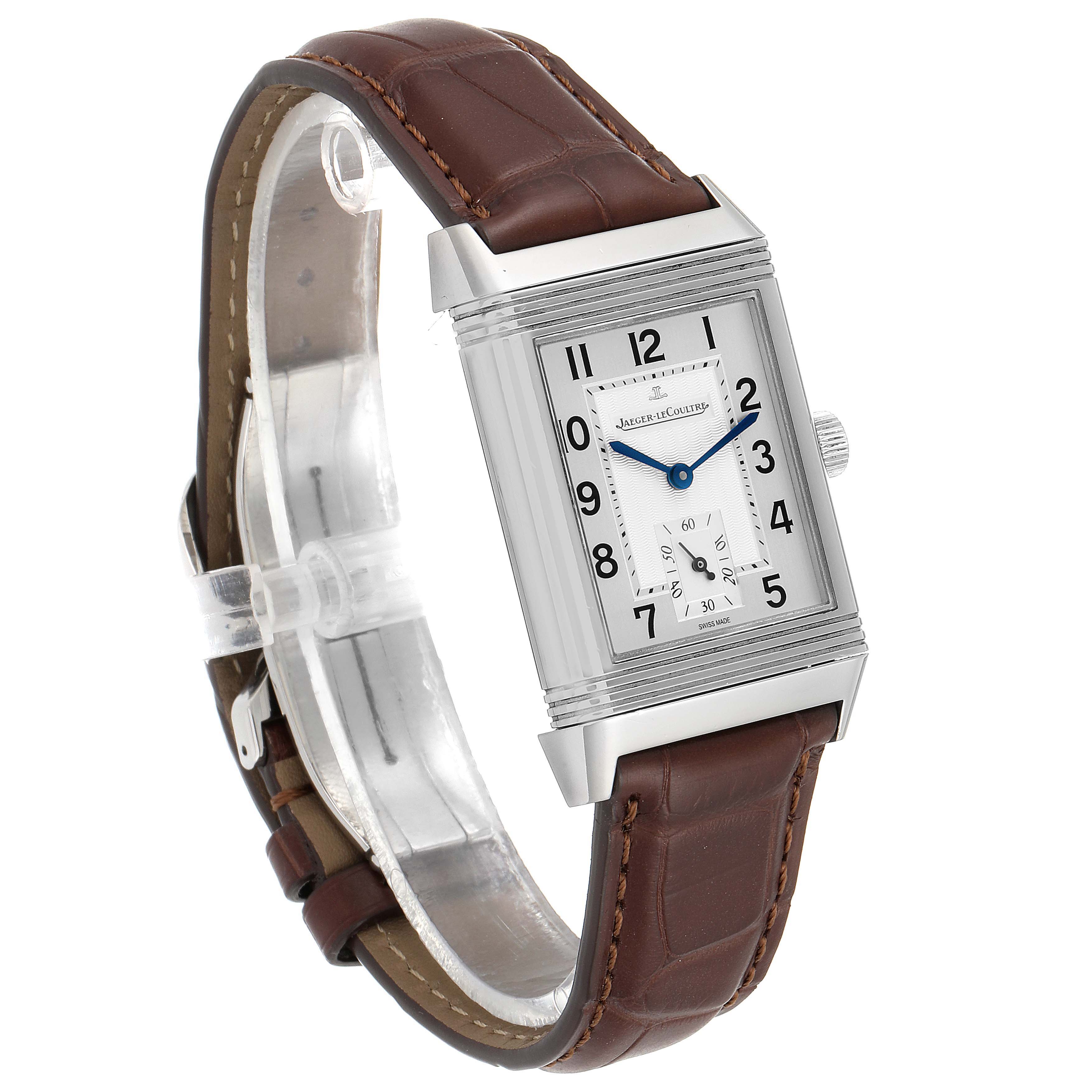 The image shows a Jaeger-LeCoultre Reverso watch from a side angle, displaying its rectangular dial and brown leather strap.
