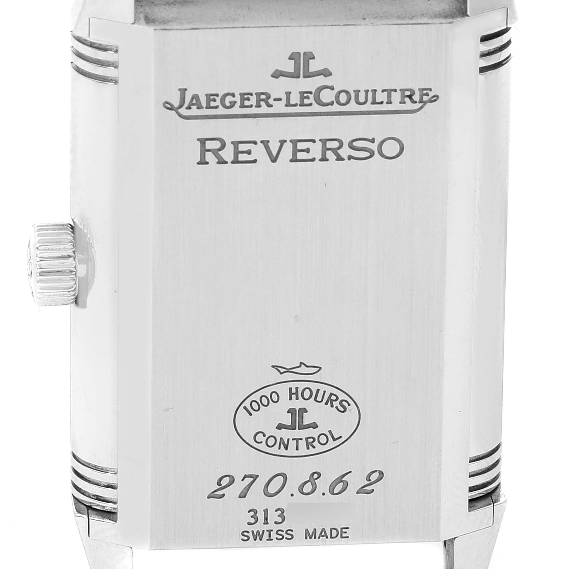 The image shows the back of the case of a Jaeger-LeCoultre Reverso watch, including the crown and various inscriptions.