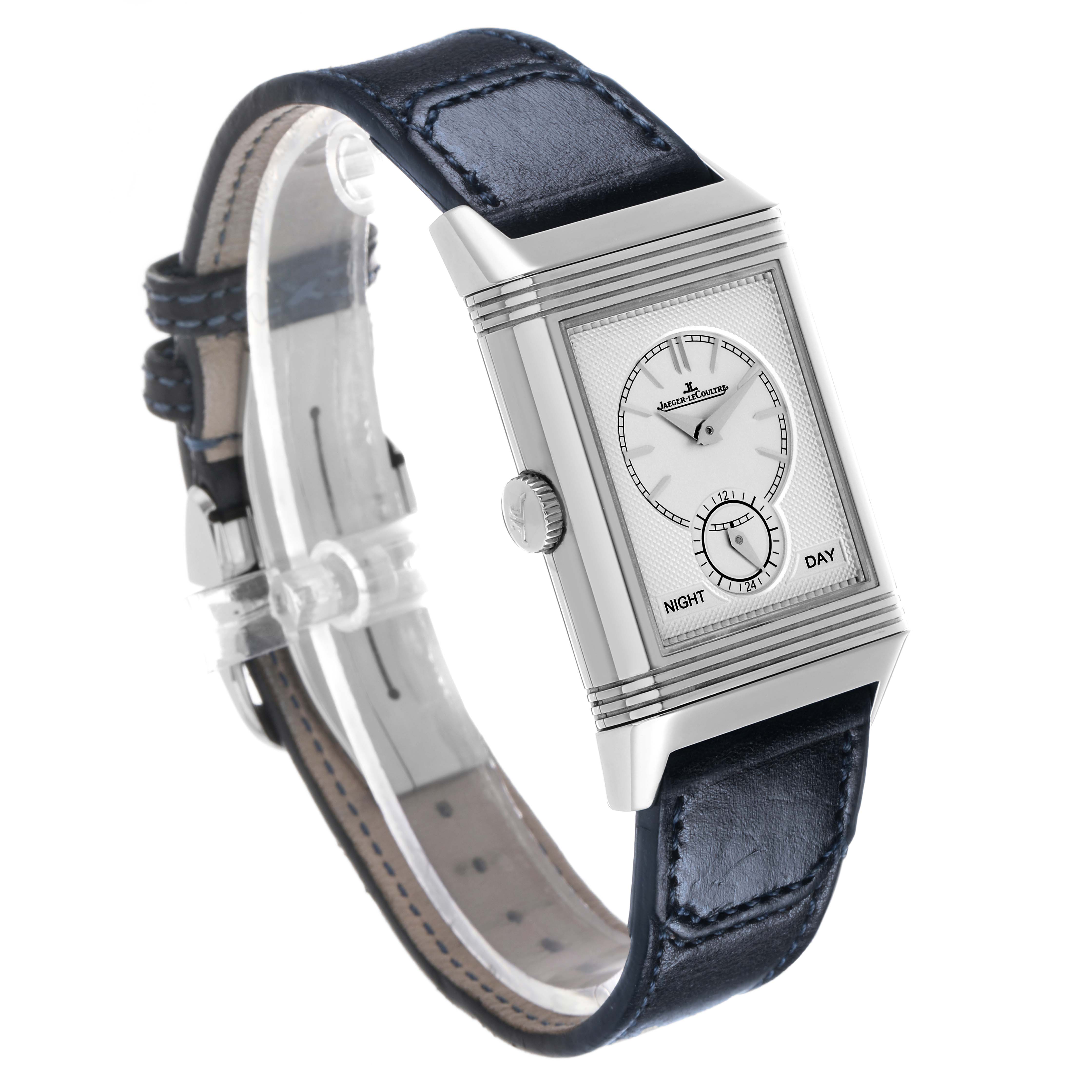 The Jaeger-LeCoultre Reverso watch is shown at an angle highlighting its face, side profile, crown, and leather strap.