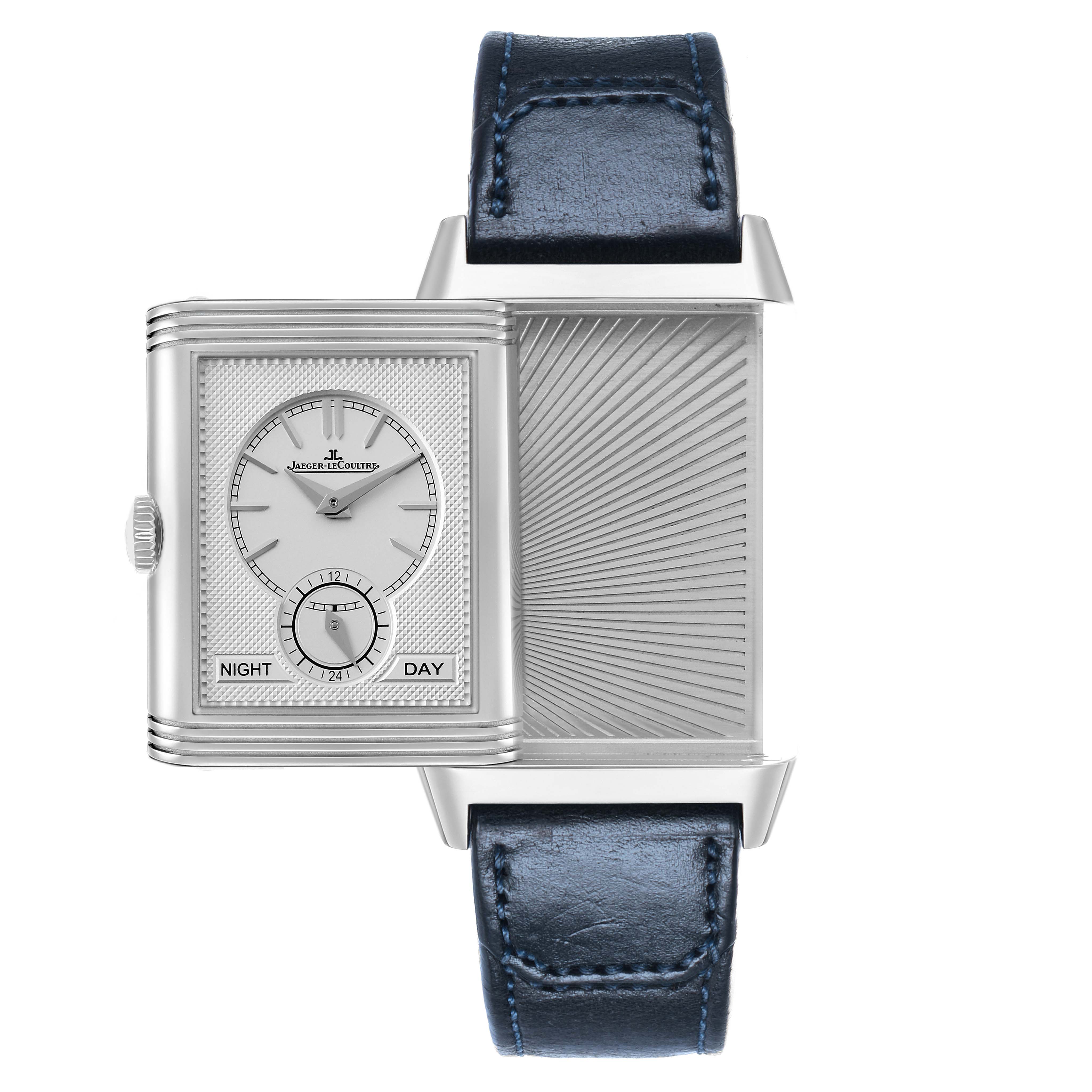 The Jaeger-LeCoultre Reverso watch is shown at an angle displaying its reversible case and dual-sided design.