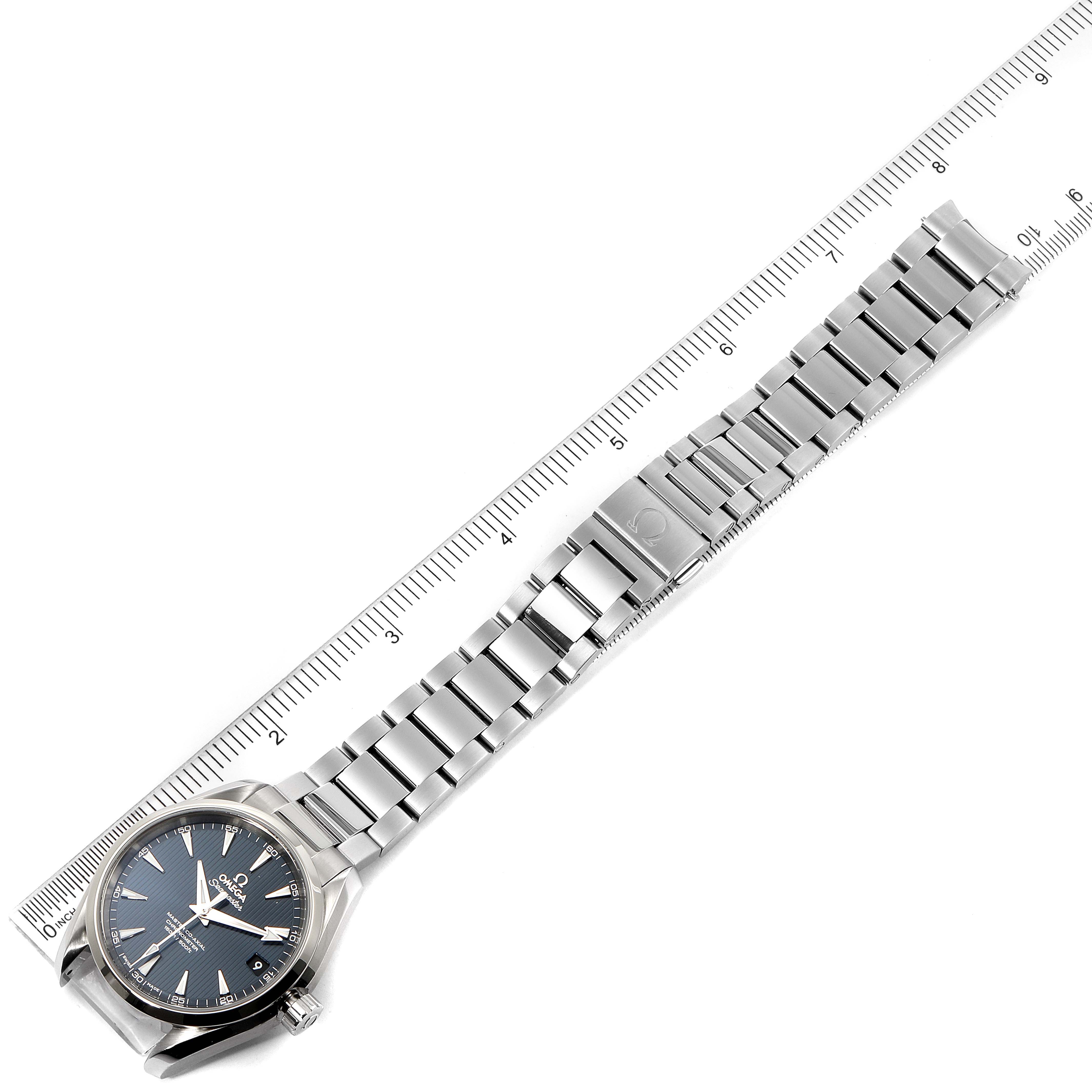 The Omega Aqua Terra 231.10.39.21.03.002 Men
s Stainless Steel Blue Dial 231.10.39.21.03.002 Men
s Stainless Steel Blue Dial watch is shown from an overhead angle, displaying its face, bracelet, and clasp next to a ruler.