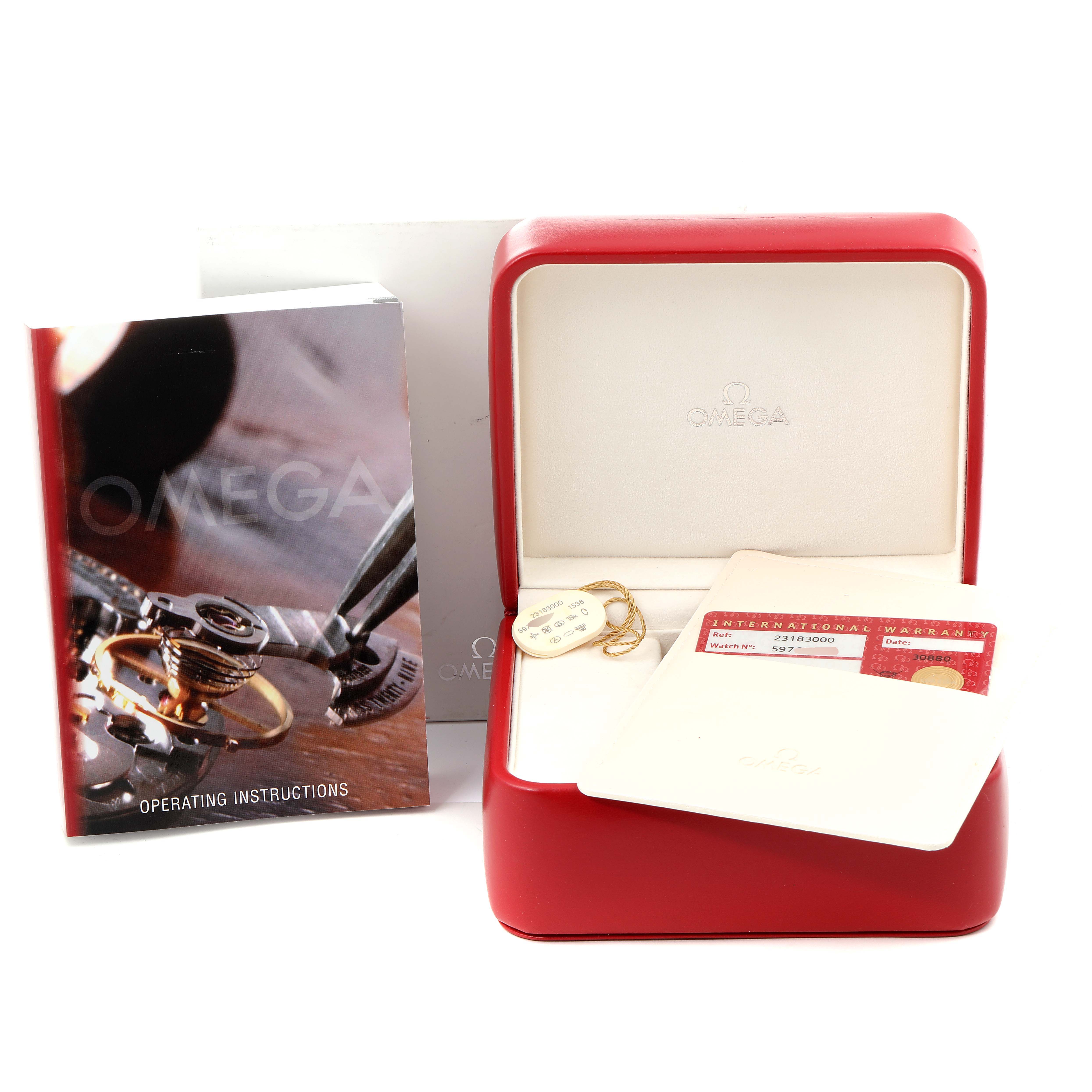 This image shows an Omega Aqua Terra 2318.30.00 Men's Steel and Gold (two tone) Silver Dial 2318.30.00 Men's Steel and Gold (two tone) Silver Dial watch box, warranty card, operating instructions, and a tag.