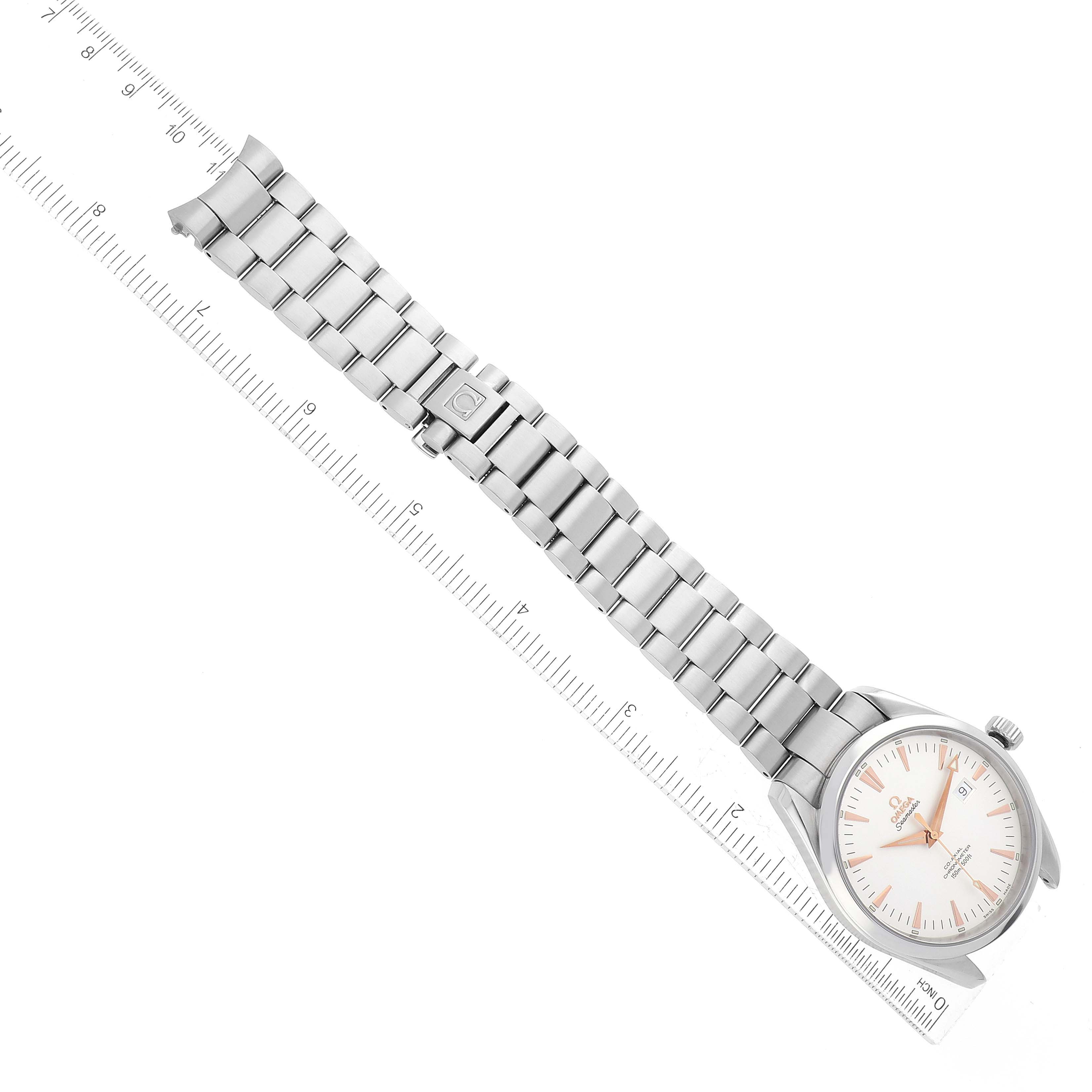 The image shows an Omega Aqua Terra 2502.34.00 Men
s Stainless Steel Silver Dial 2502.34.00 Men
s Stainless Steel Silver Dial watch laid flat with a ruler next to it, highlighting the watch face and metal bracelet.