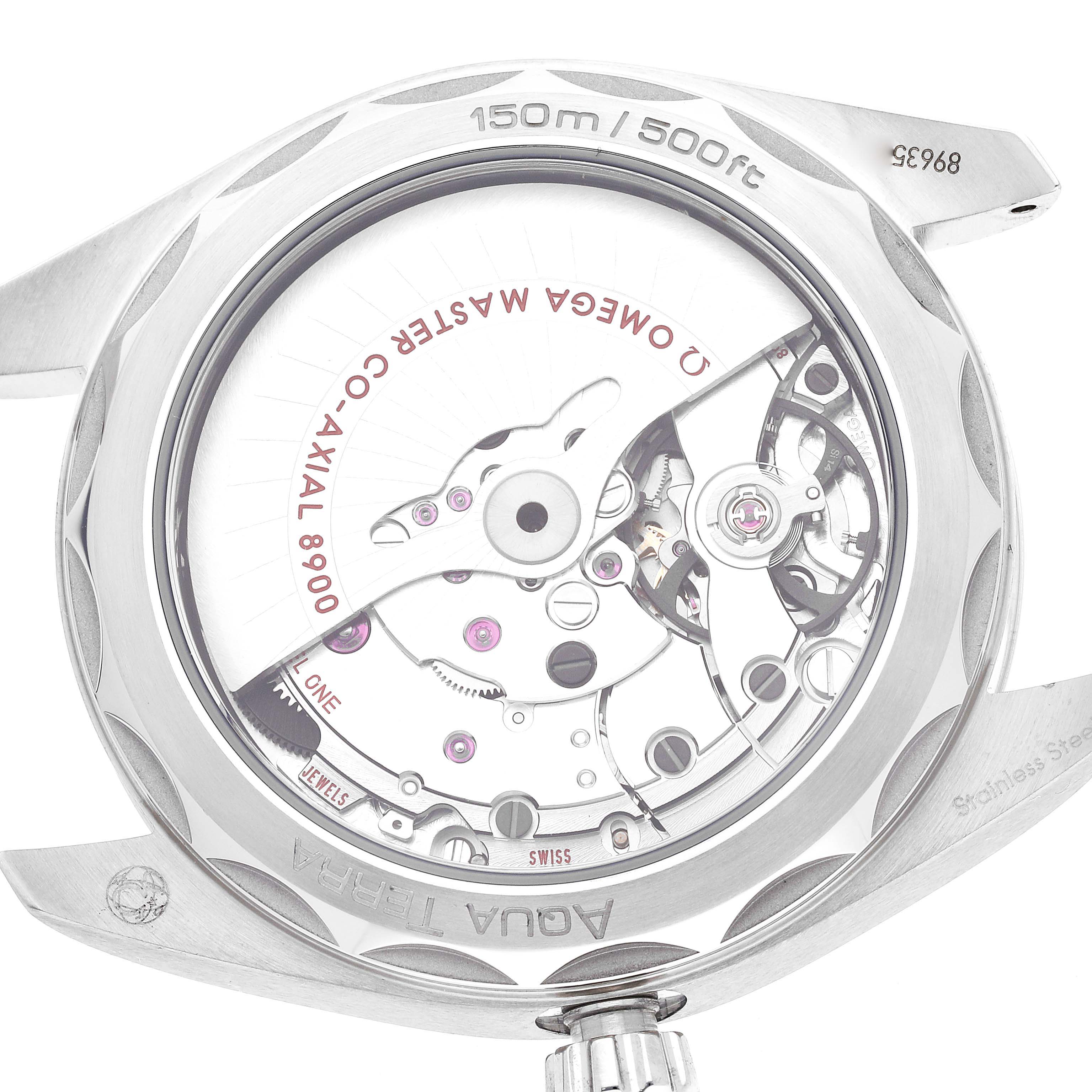 The image shows the back of the Omega Aqua Terra 220.13.41.21.03.002 Men's Stainless Steel Blue Dial 220.13.41.21.03.002 Men's Stainless Steel Blue Dial watch, highlighting the exposed Co-Axial 8900 master chronometer movement.