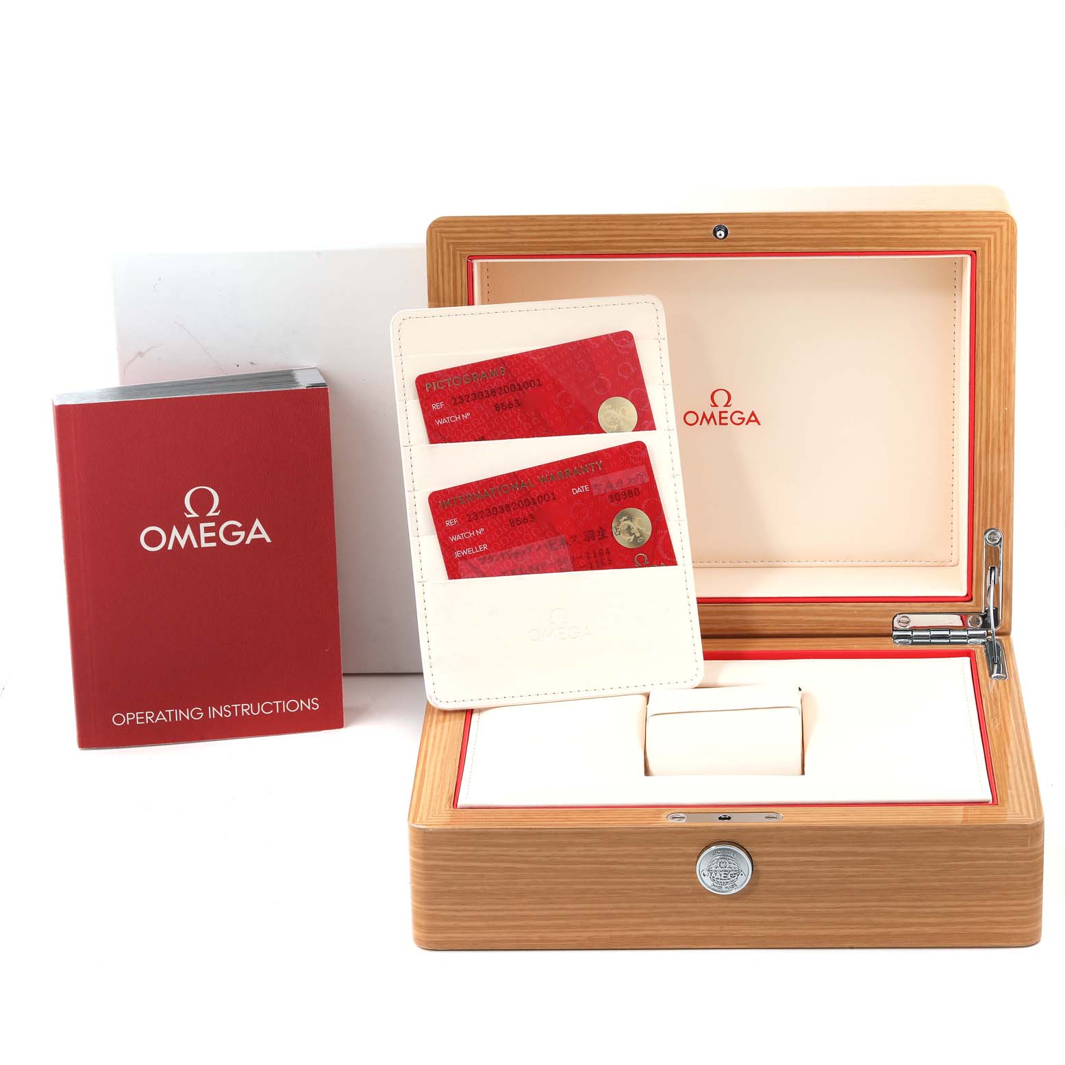 The image shows the packaging, warranty cards, and operating instructions for an Omega Planet Ocean 232.30.38.20.01.001 Men
s Stainless Steel Black Dial 232.30.38.20.01.001 Men
s Stainless Steel Black Dial watch.