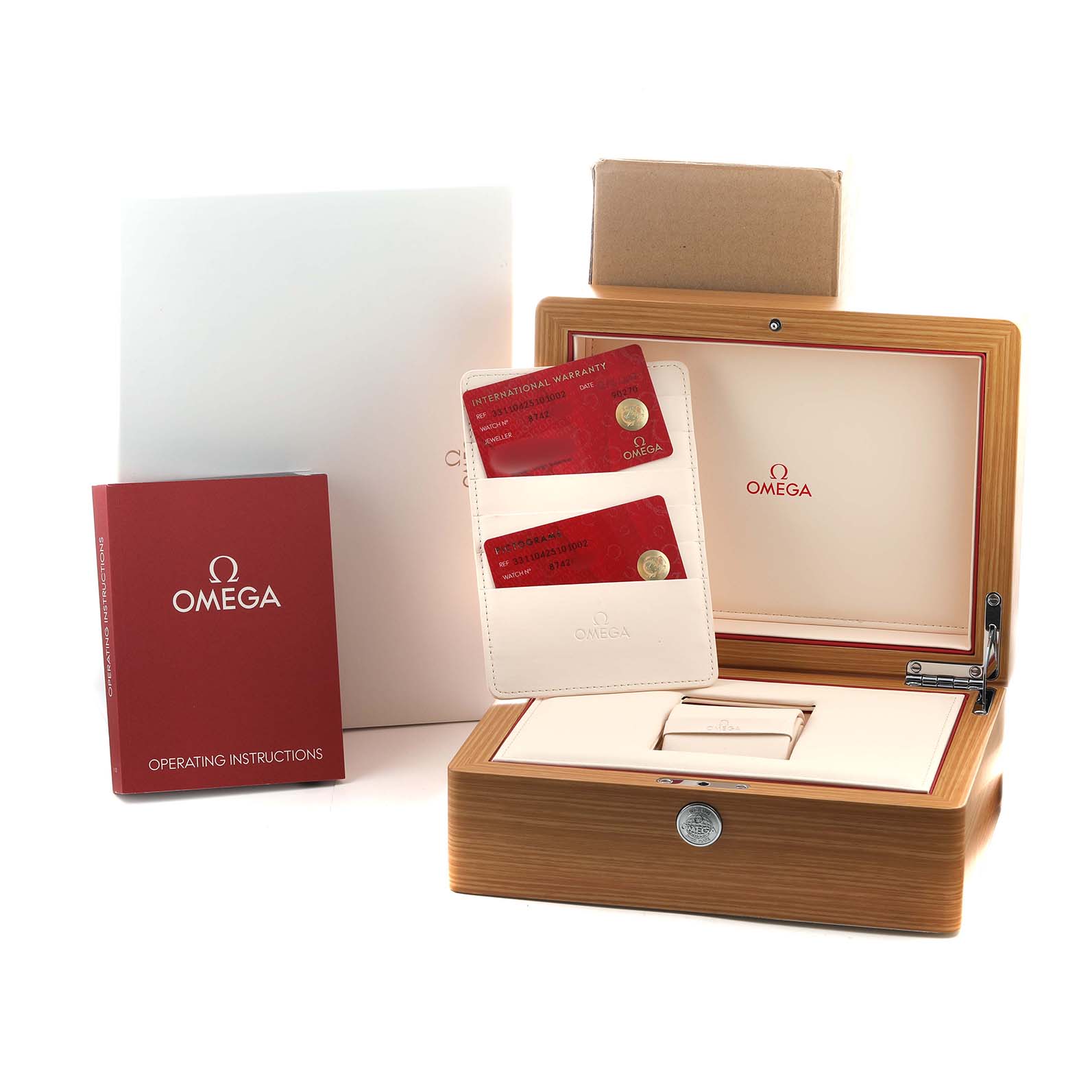 The image shows the Omega Speedmaster 331.10.42.51.01.002 Men's Stainless Steel Black Dial's packaging, including the box, warranty cards, and instruction manual.