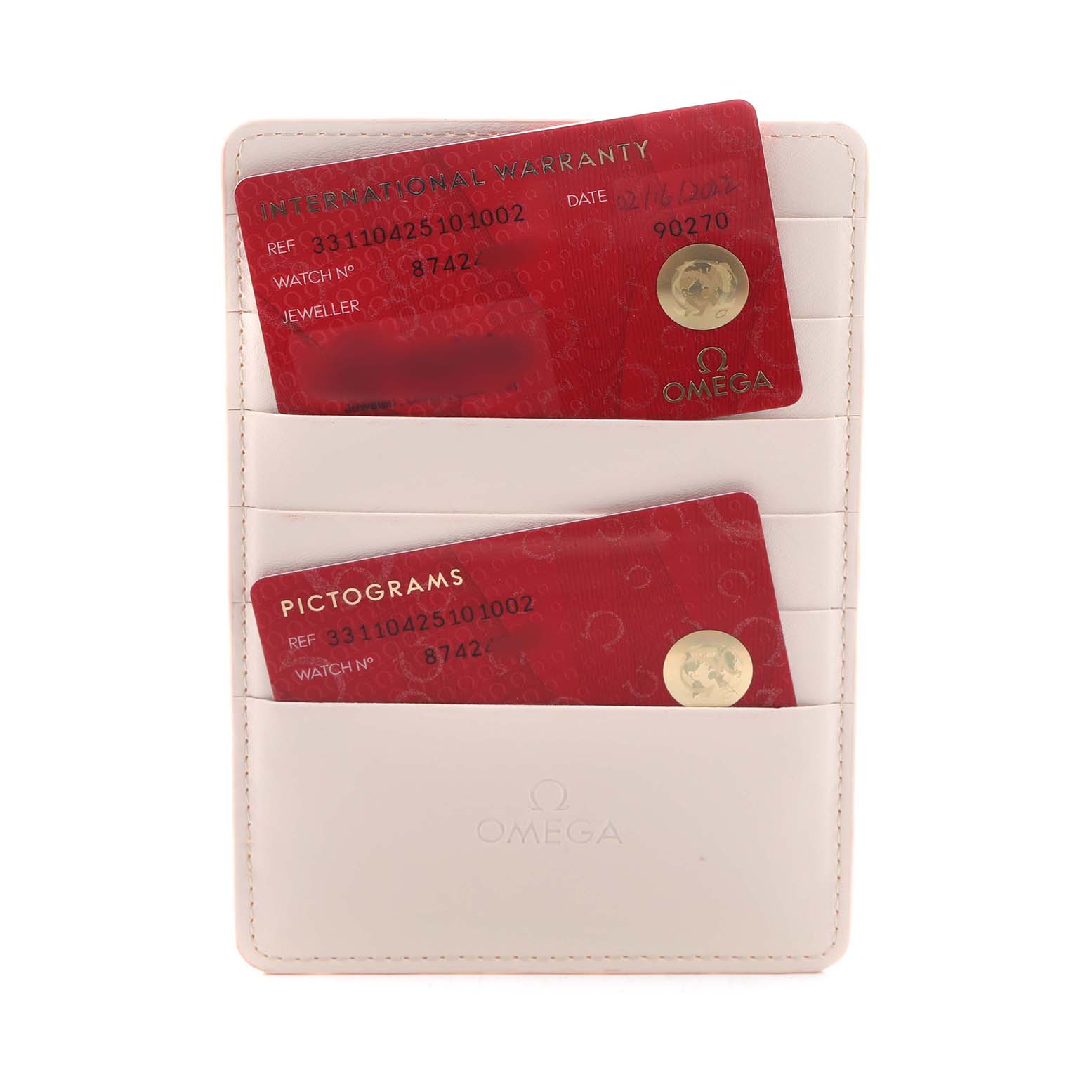 The image shows warranty and pictogram cards for the Omega Speedmaster 331.10.42.51.01.002 Men's Stainless Steel Black Dial, placed inside a white cardholder.