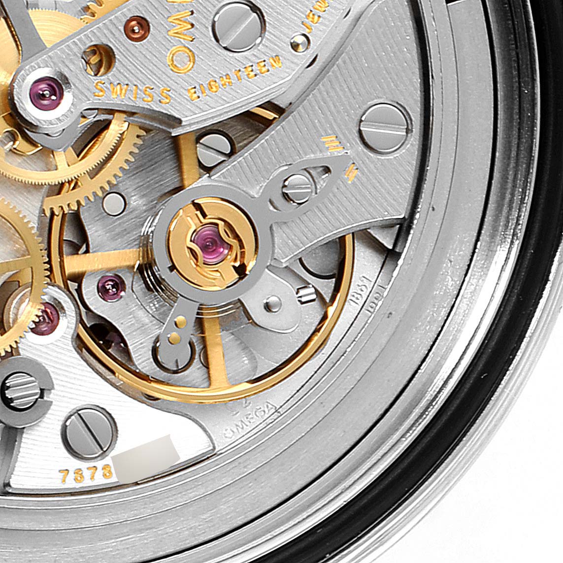 This close-up image showcases the intricate movement and gears of the Omega Speedmaster 311.30.42.30.01.005 Men
s Stainless Steel Black Dial 311.30.42.30.01.005 Men
s Stainless Steel Black Dial watch, emphasizing its mechanical details.