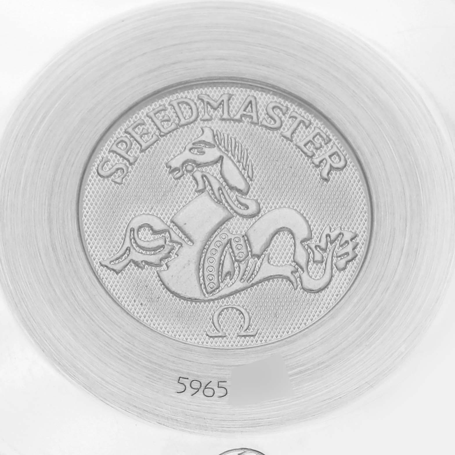 The image shows an embossed medallion of the Omega Speedmaster 3534.72.00 Men's Stainless Steel Mother of Pearl Dial 3534.72.00 Men's Stainless Steel Mother of Pearl Dial back cover with a horse emblem.