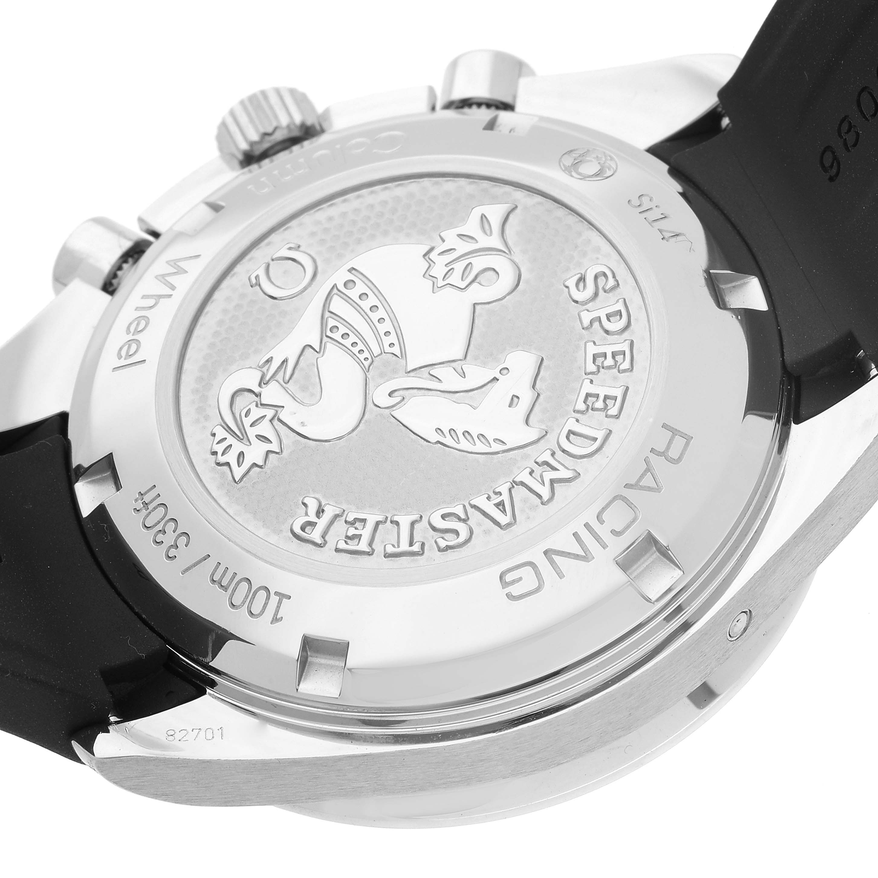 The image shows the case back of an Omega Speedmaster 326.32.40.50.01.001 Men's Stainless Steel Black Dial 326.32.40.50.01.001 Men's Stainless Steel Black Dial Racing watch at an angle, highlighting the engraved logo and text.