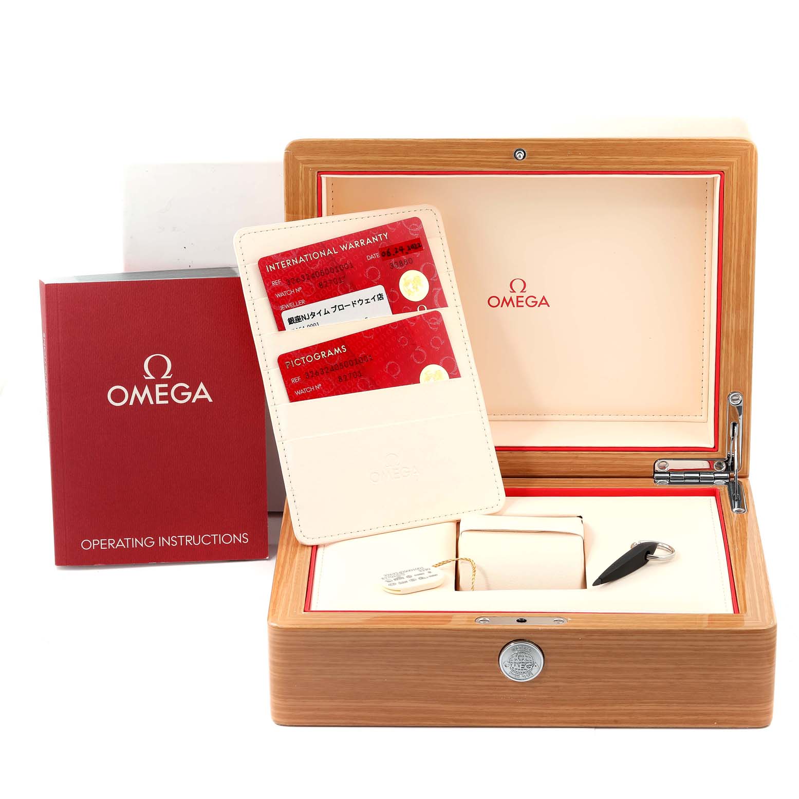 The image shows the box, warranty cards, and manual of an Omega Speedmaster 326.32.40.50.01.001 Men's Stainless Steel Black Dial 326.32.40.50.01.001 Men's Stainless Steel Black Dial watch from a front angle.