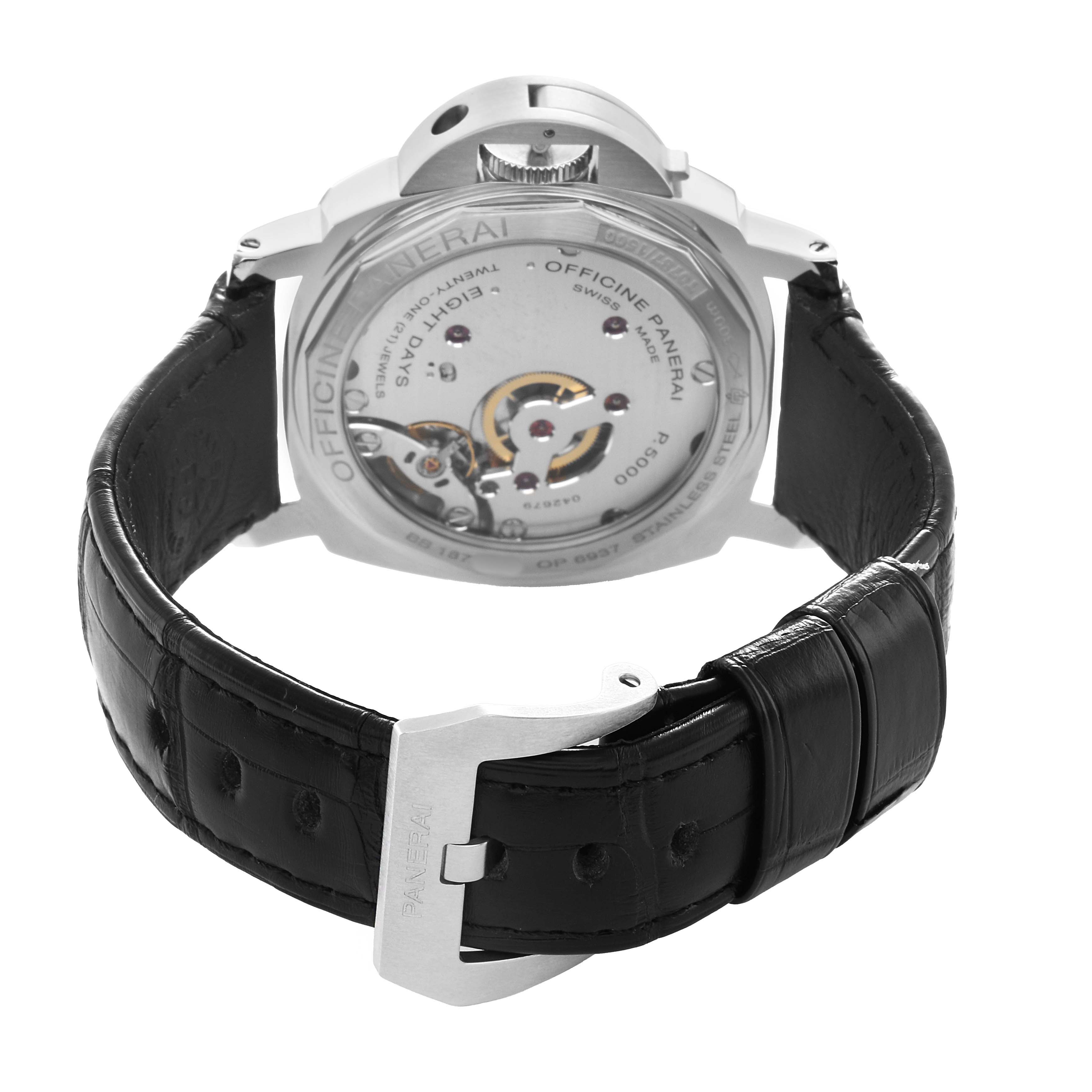 The image shows the back view of a Panerai Luminor PAM00560 Men's Stainless Steel Black Dial watch, highlighting the see-through caseback and leather strap.