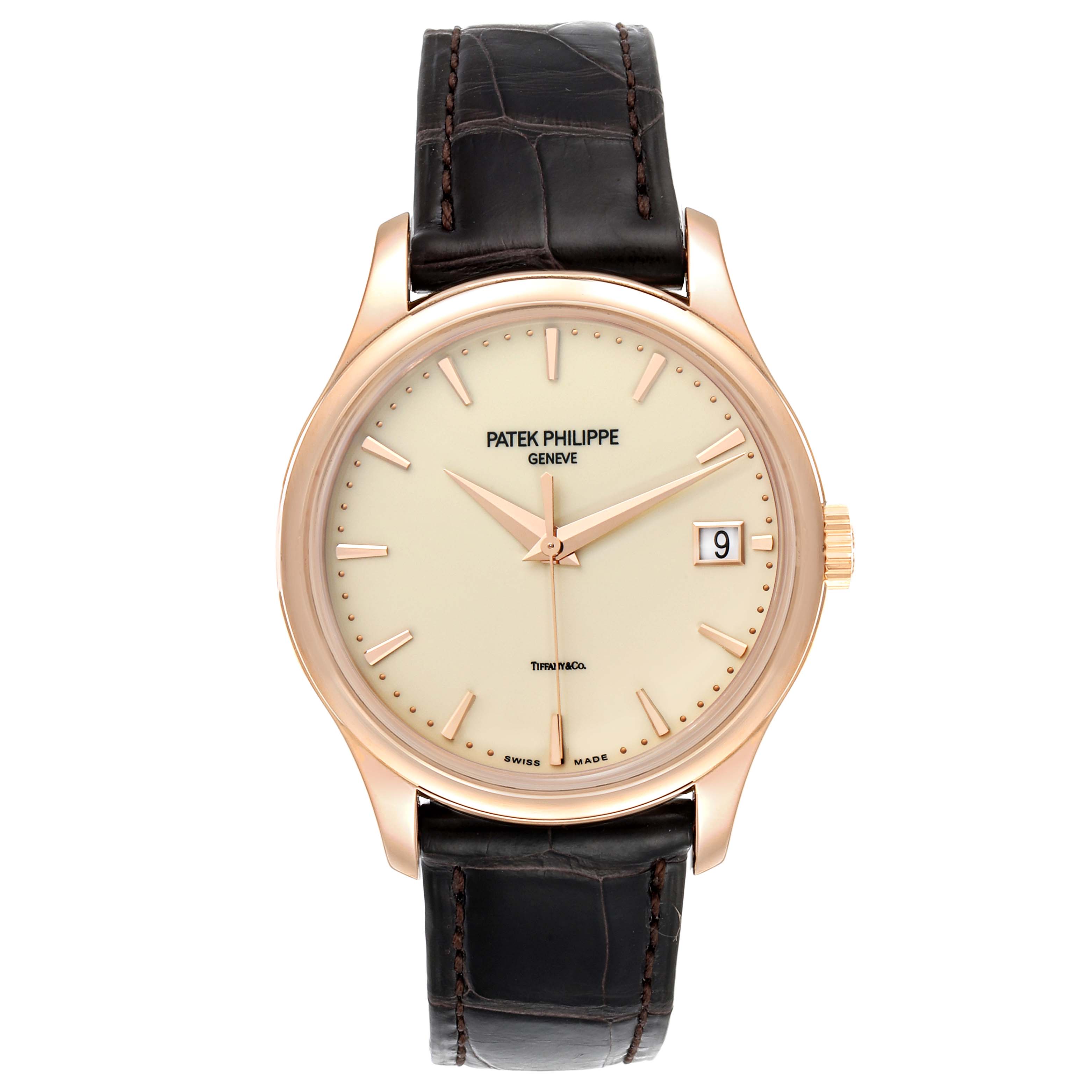 The image shows a front view of a Patek Philippe Calatrava 5227R Men
s Rose Gold Beige Dial 5227R Men
s Rose Gold Beige Dial watch, highlighting its dial, hands, crown, and leather strap.
