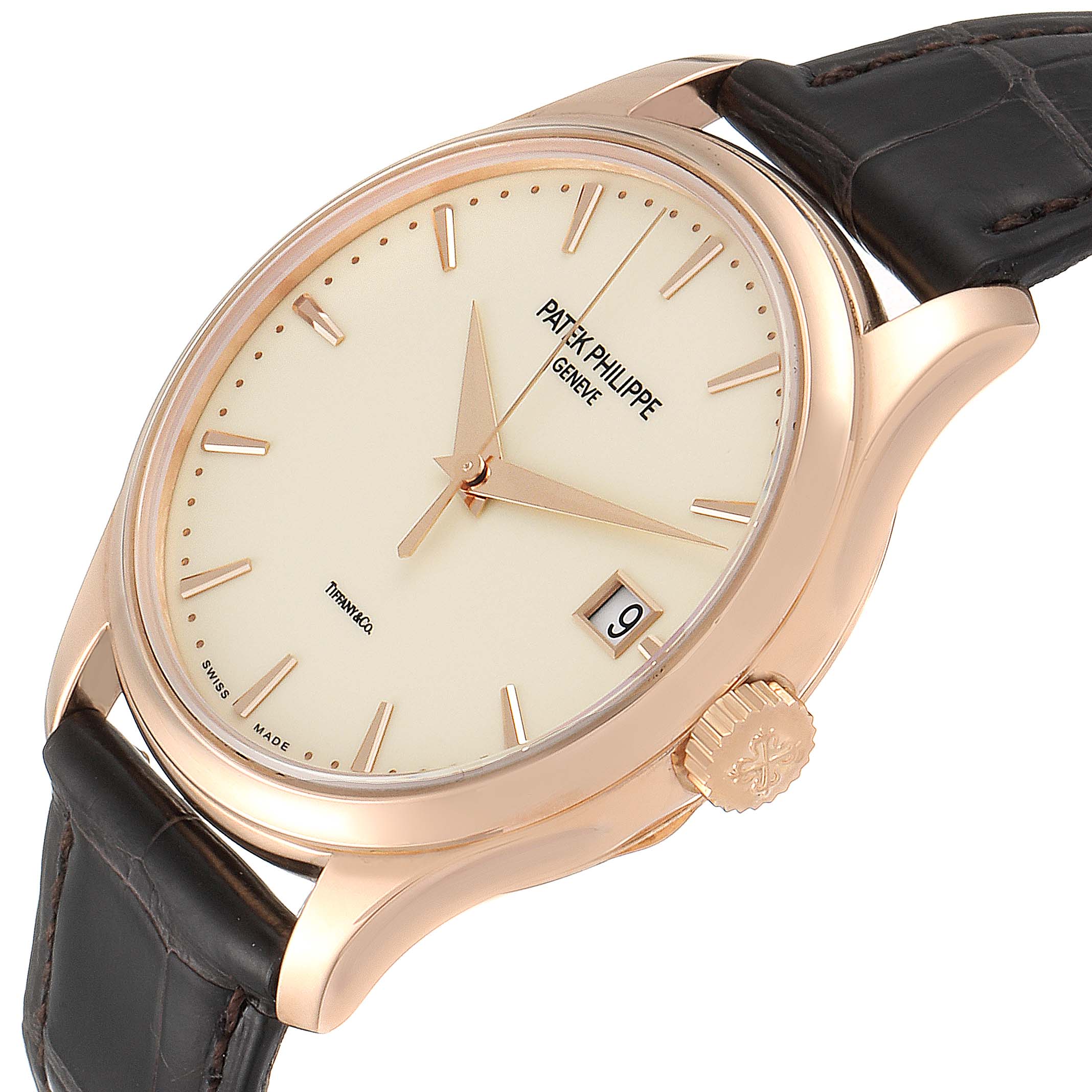 The image shows a Patek Philippe Calatrava 5227R Men
s Rose Gold Beige Dial 5227R Men
s Rose Gold Beige Dial watch from a tilted side view, highlighting the dial, crown, and strap.