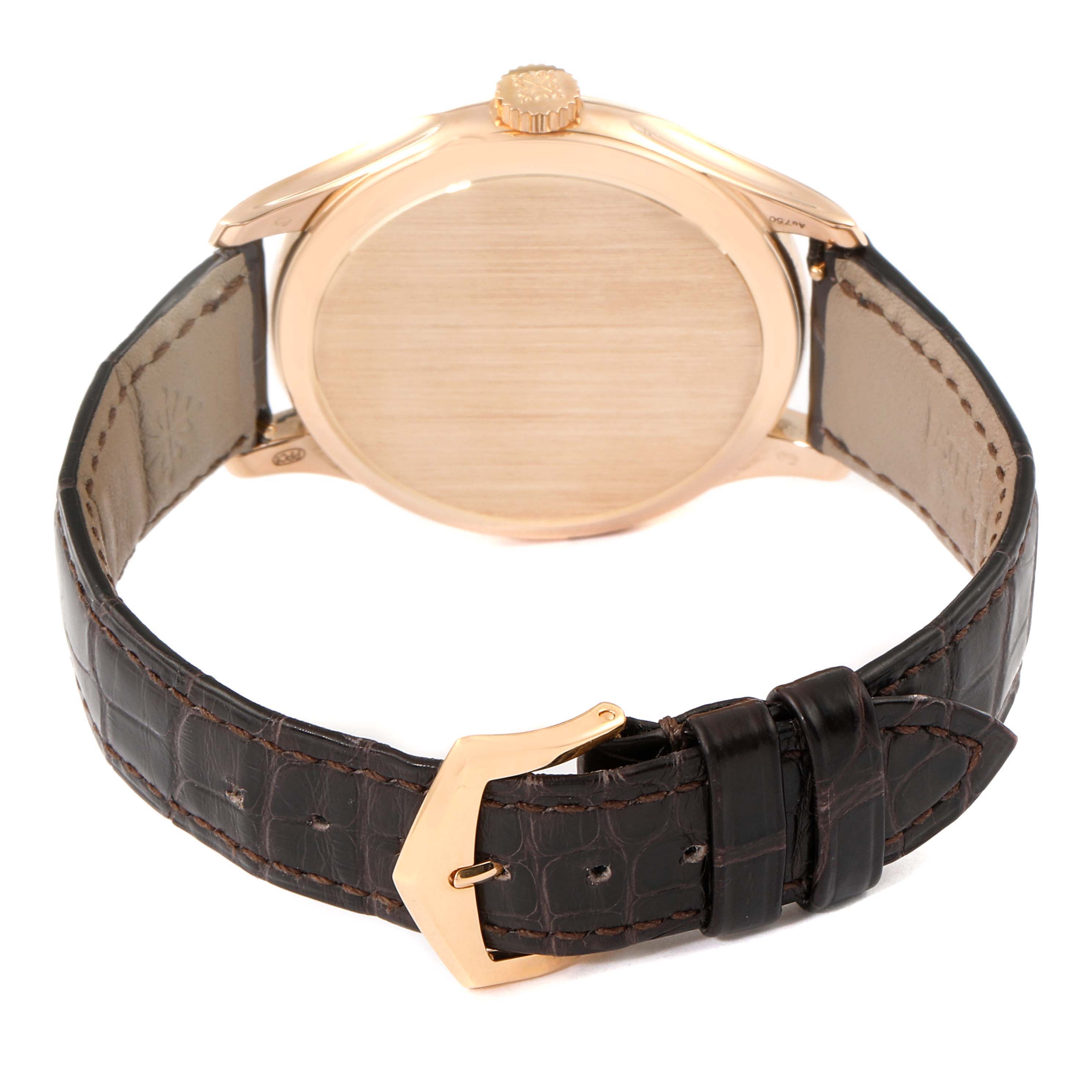The image shows the back view of the Calatrava watch by Patek Philippe, highlighting the case, crown, and leather strap with buckle.