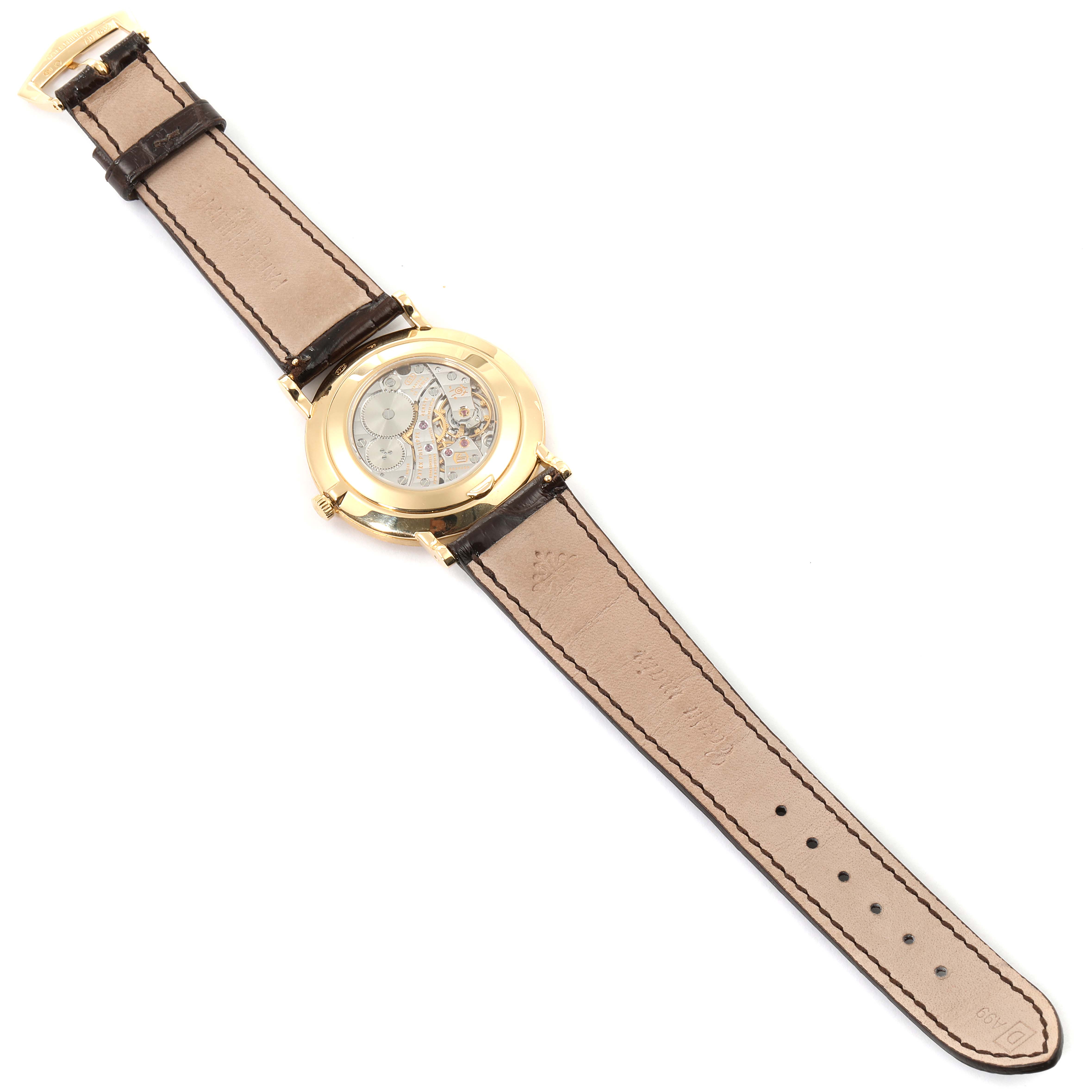 The image shows the back view of a Patek Philippe Calatrava 5119J Men's Yellow Gold White Dial 5119J Men's Yellow Gold White Dial watch, highlighting the leather strap and visible mechanical movement.