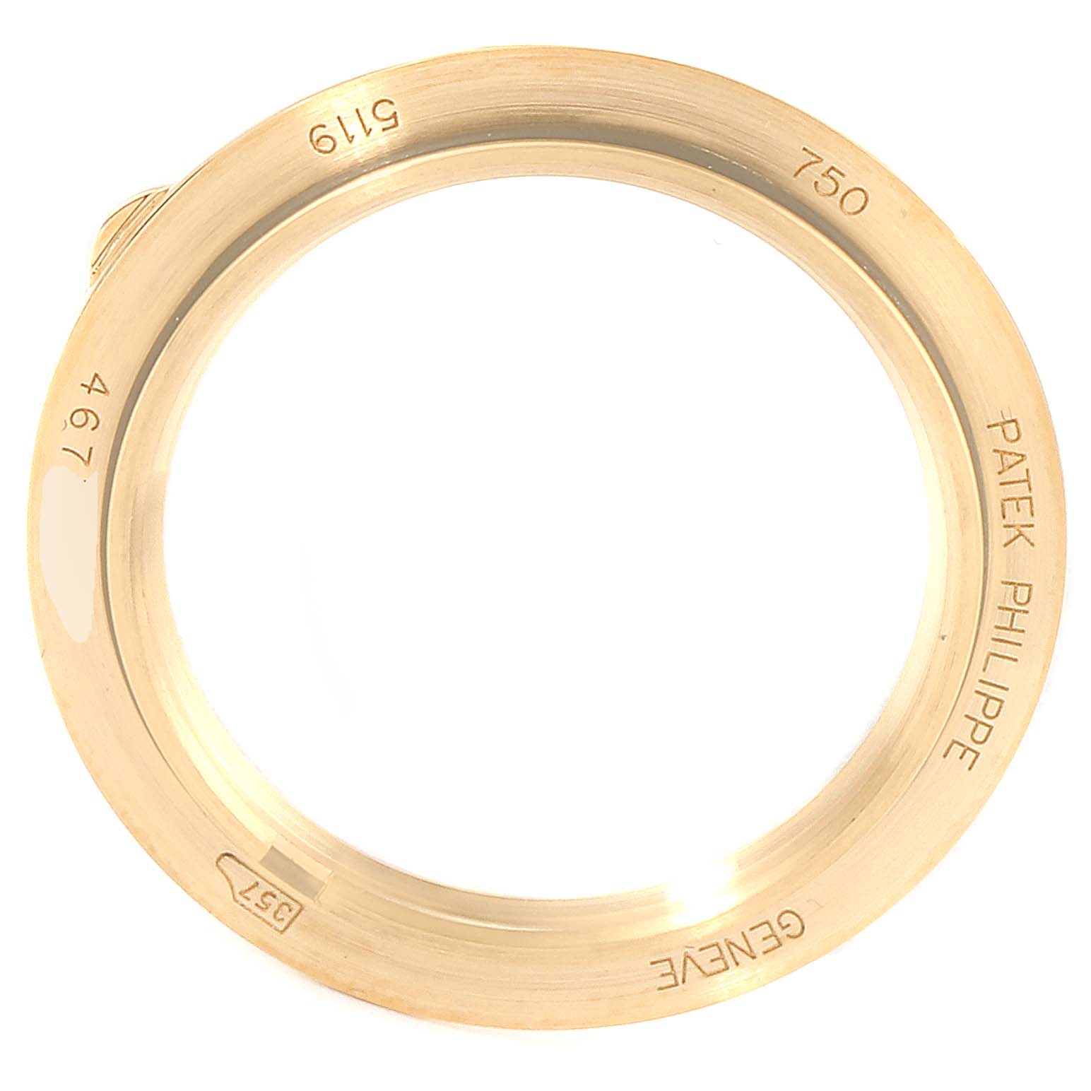 This image shows the gold bezel of a Patek Philippe Calatrava 5119J Men's Yellow Gold White Dial 5119J Men's Yellow Gold White Dial watch from a top-down angle.