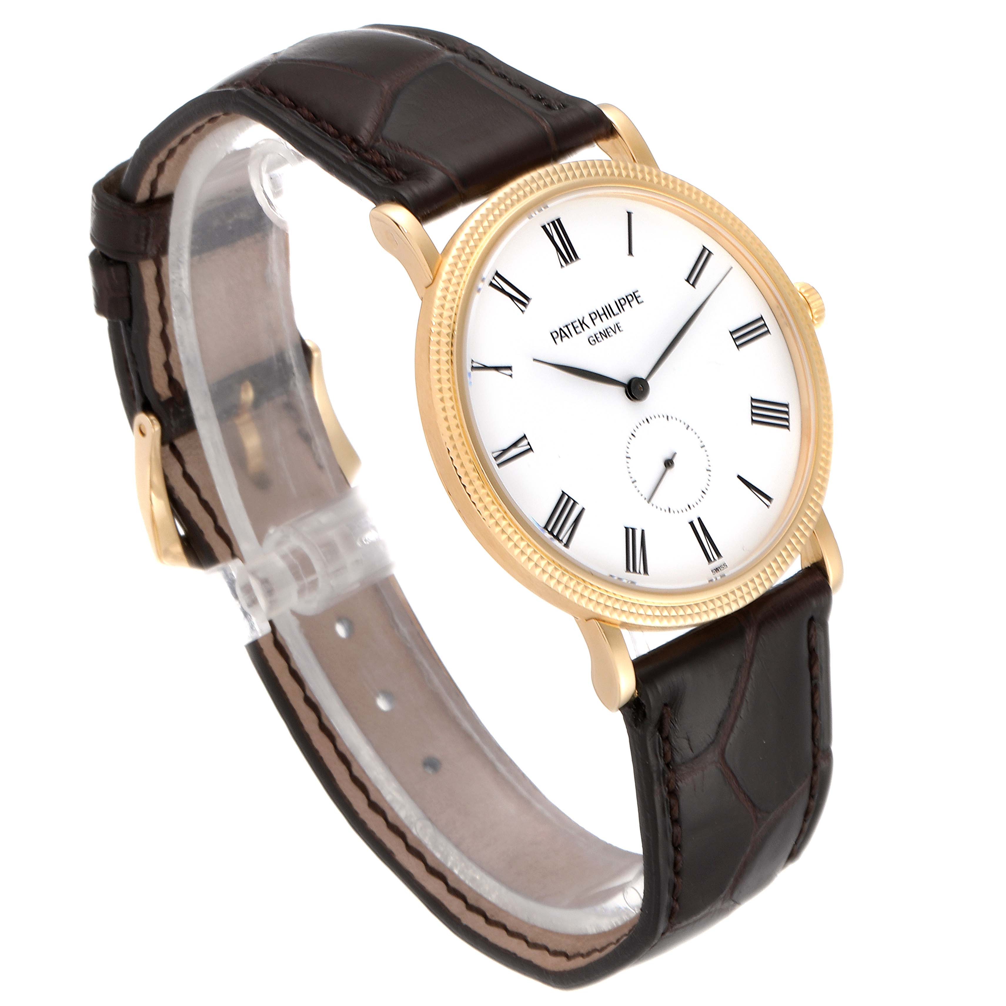 This image shows a Patek Philippe Calatrava 5119J Men's Yellow Gold White Dial 5119J Men's Yellow Gold White Dial watch at a three-quarter angle, highlighting its dial, case, and leather strap.