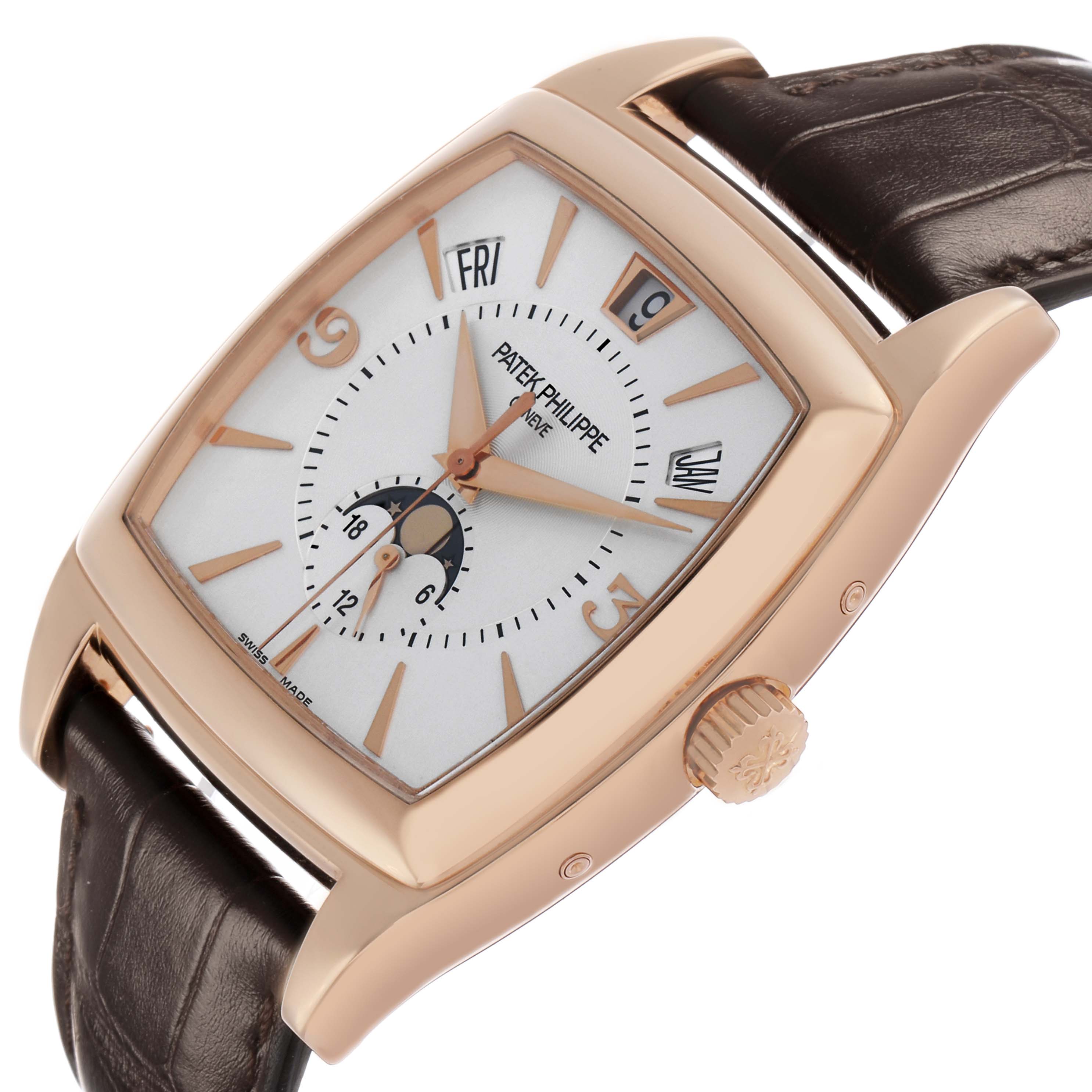 The Patek Philippe Gondolo 5135 5135R Men's Rose Gold White Dial watch is shown at a tilted angle, displaying the dial, crown, and part of the strap.