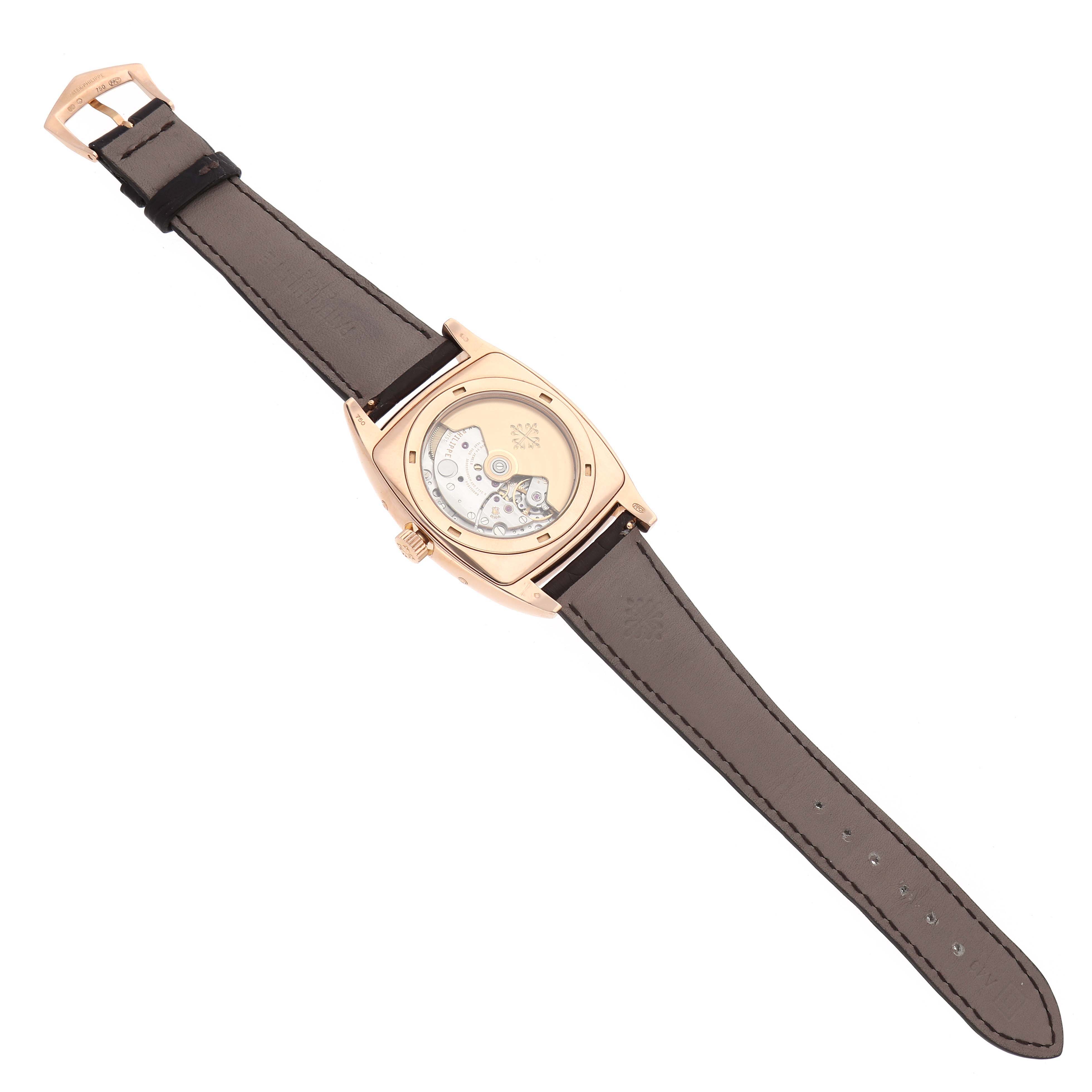 The image shows a Patek Philippe Gondolo 5135 5135R Men's Rose Gold White Dial watch from the back, highlighting the transparent case and movement.