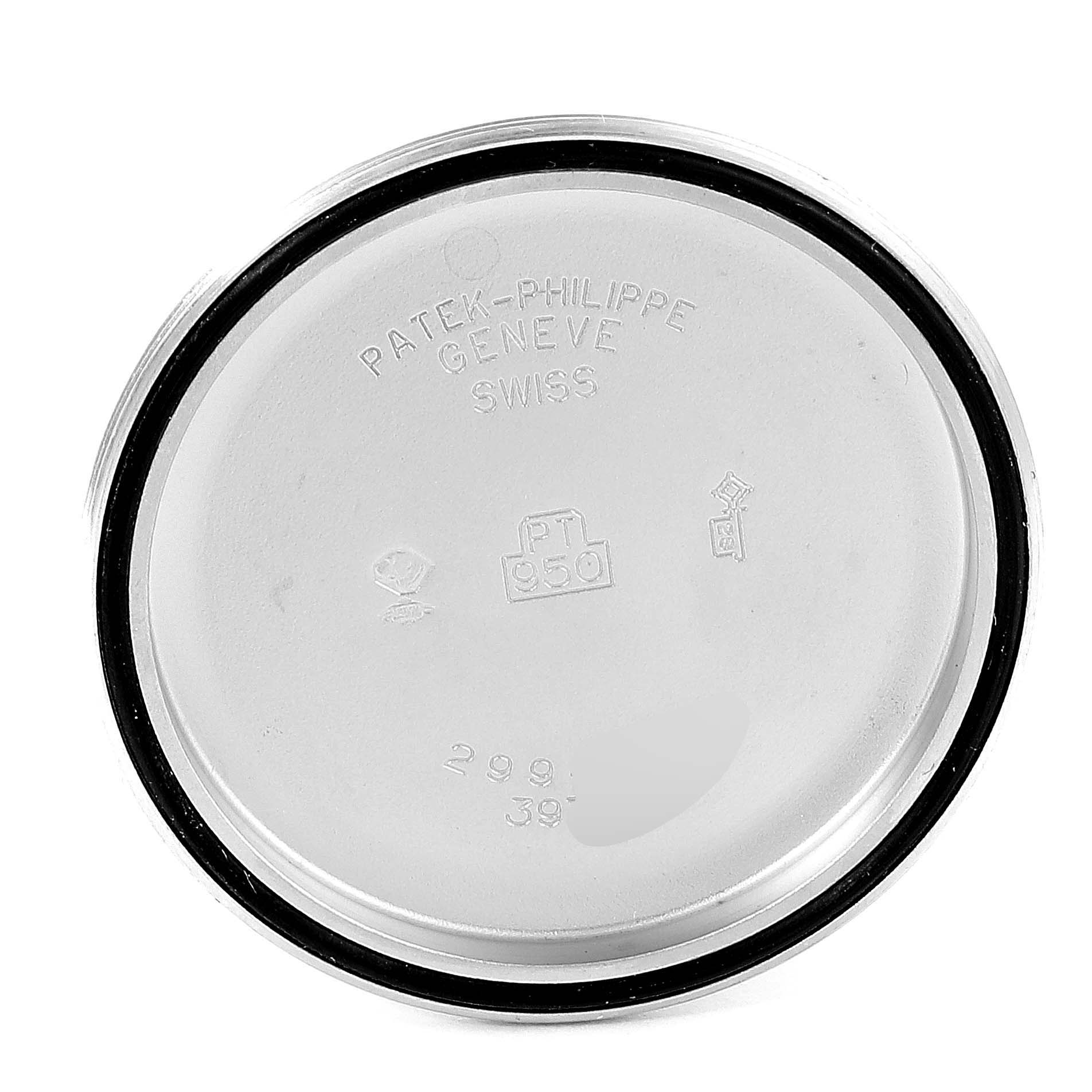 This image shows the interior case back of a Patek Philippe Complications 3970EP Men's Platinum Black Dial 3970EP Men's Platinum Black Dial watch, featuring engraving and hallmarks.