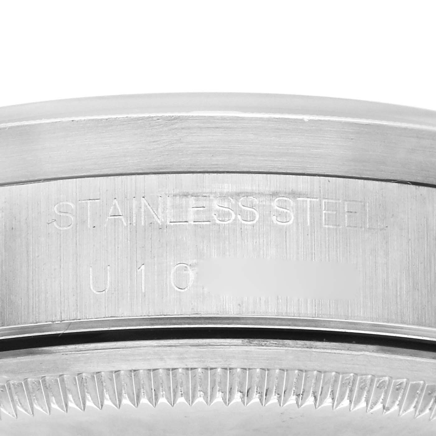 The image shows a close-up of the side of a Rolex Air-King 14010 Men's Stainless Steel Pink Dial 14010 Men's Stainless Steel Pink Dial watch, highlighting the stainless steel and the serial number area.