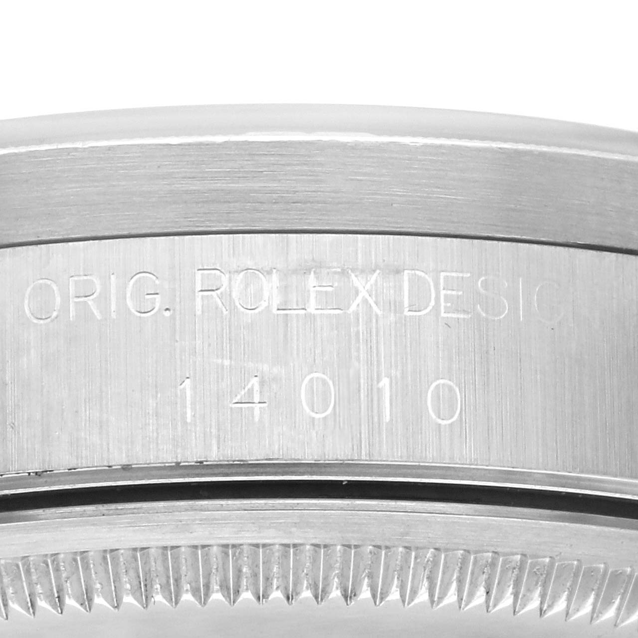 The image shows the engraved edge of the case back of a Rolex Air-King 14010 Men's Stainless Steel Pink Dial 14010 Men's Stainless Steel Pink Dial, focusing on the model number and design details.