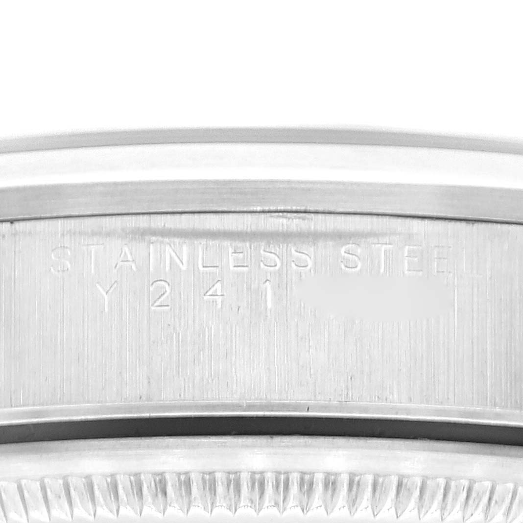 The image shows a close-up of the case back engraving on a Rolex Air-King 14000M Men's Stainless Steel Black Dial 14000M Men's Stainless Steel Black Dial watch, highlighting the stainless steel material and serial number.