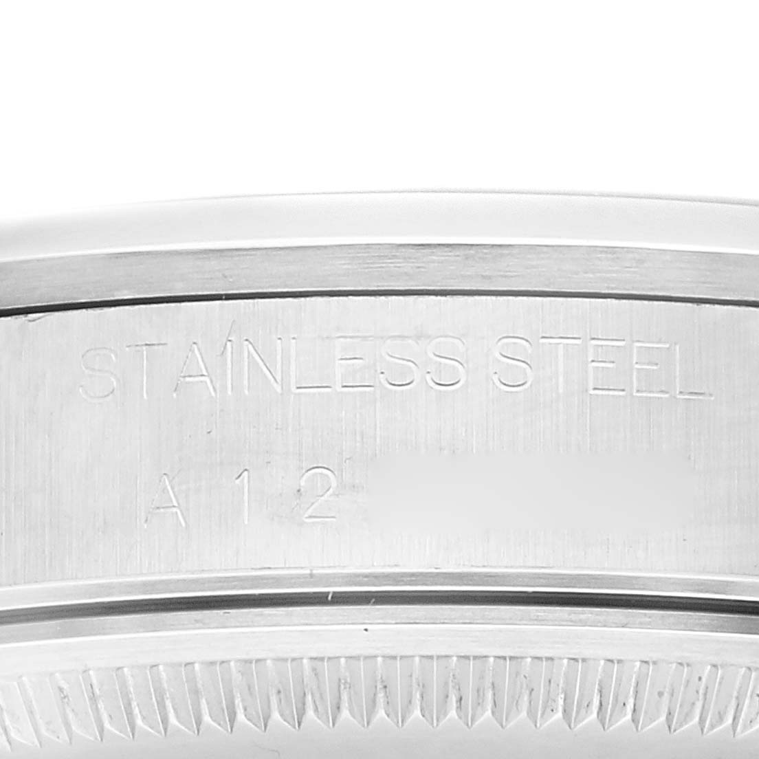 This image shows a close-up of the stainless steel case back of a Rolex Air-King 14000 Men's Stainless Steel Blue Dial 14000 Men's Stainless Steel Blue Dial watch.