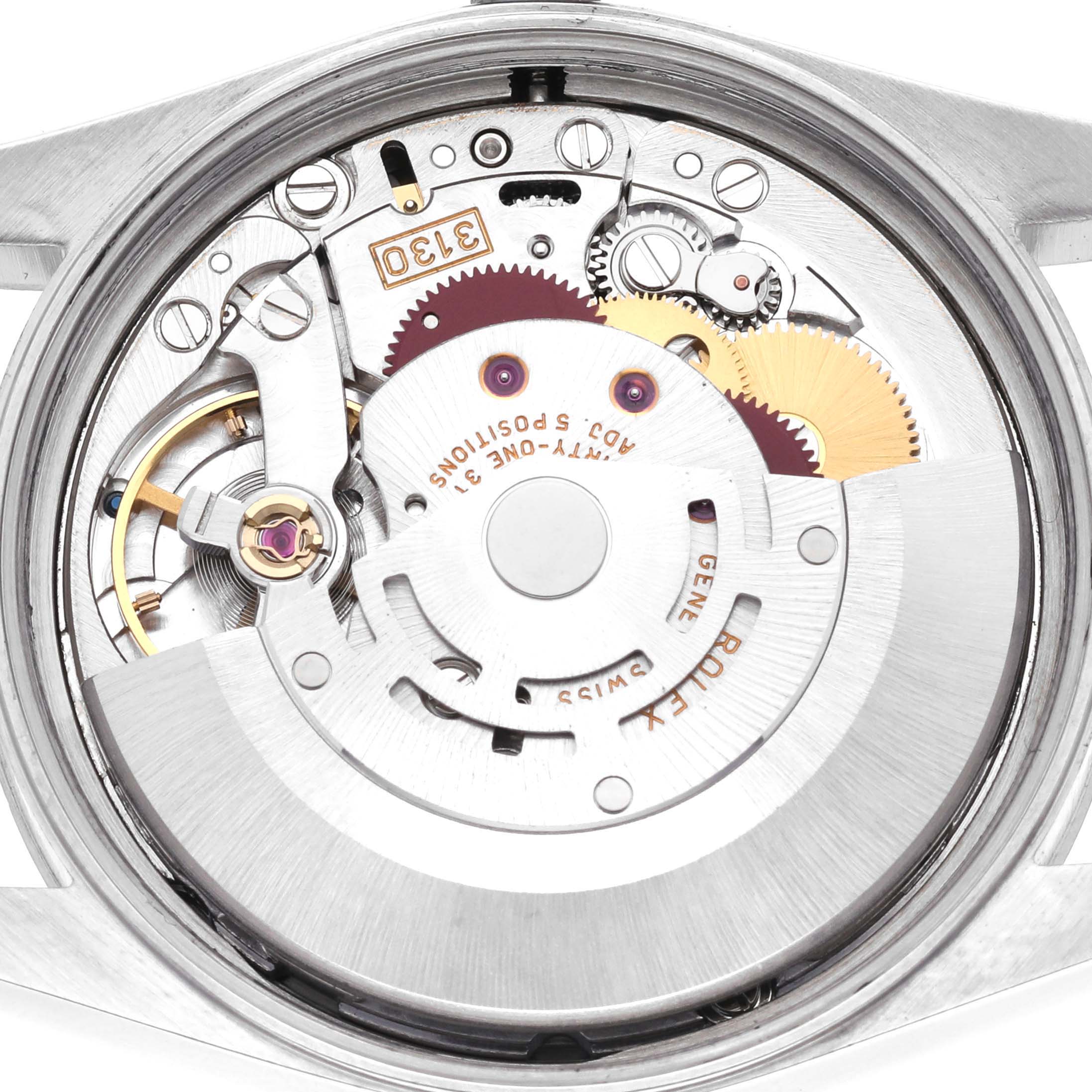 The image shows the internal mechanism of a Rolex Air-King 14000M Men's Stainless Steel Blue Dial 14000M Men's Stainless Steel Blue Dial watch from a top-down angle, revealing gears and components.