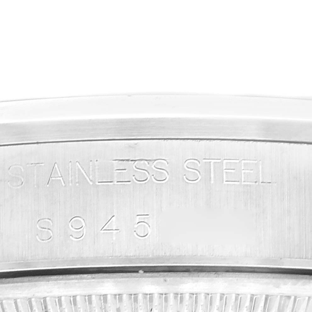 The image shows a close-up of the stainless steel case back of a Rolex Air-King 14000 Men's Stainless Steel Pink Dial 14000 Men's Stainless Steel Pink Dial with model markings.