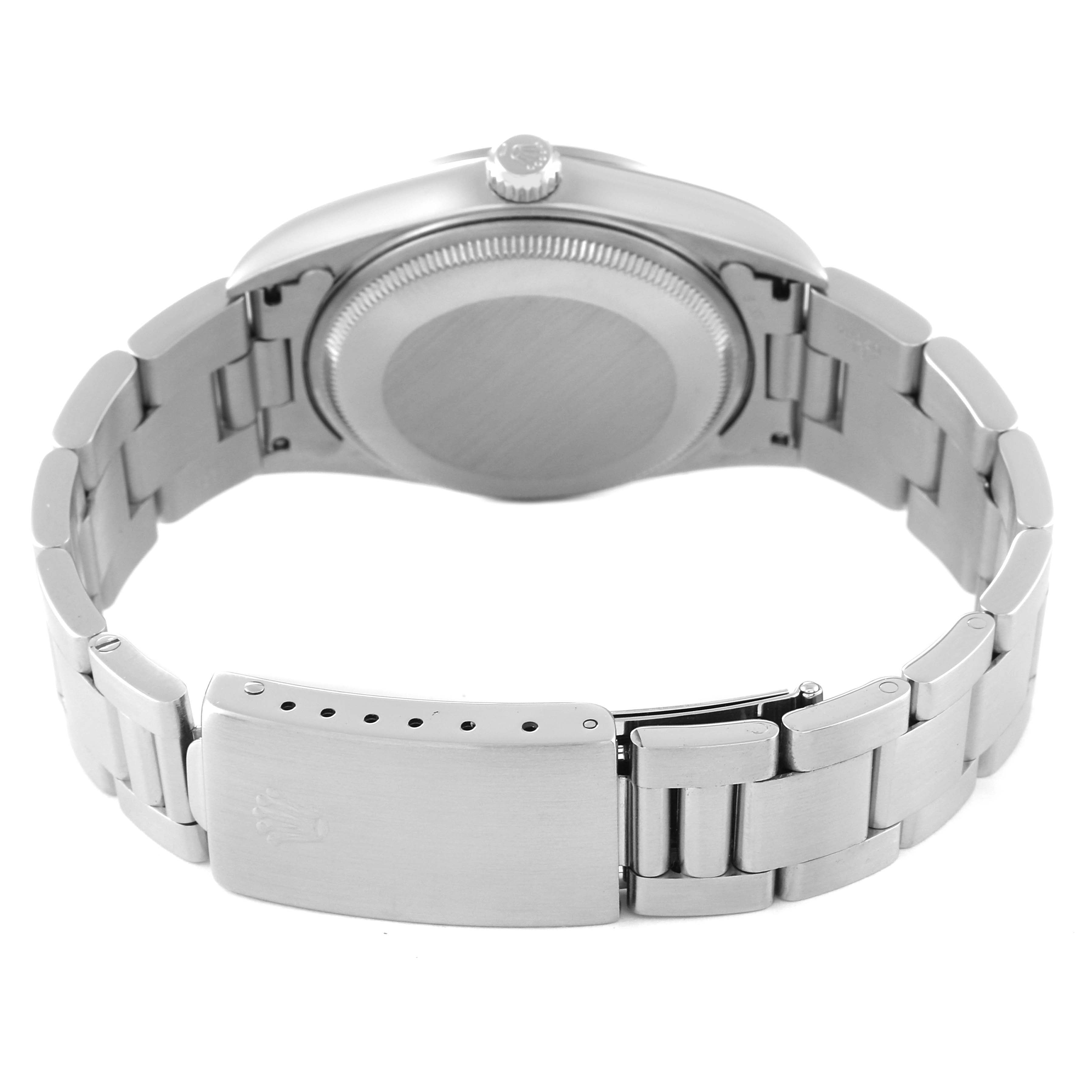 The image shows the back and clasp of the Rolex Air-King 14000 Men's Stainless Steel Silver Dial 14000 Men's Stainless Steel Silver Dial watch, highlighting its stainless steel bracelet and closed back.