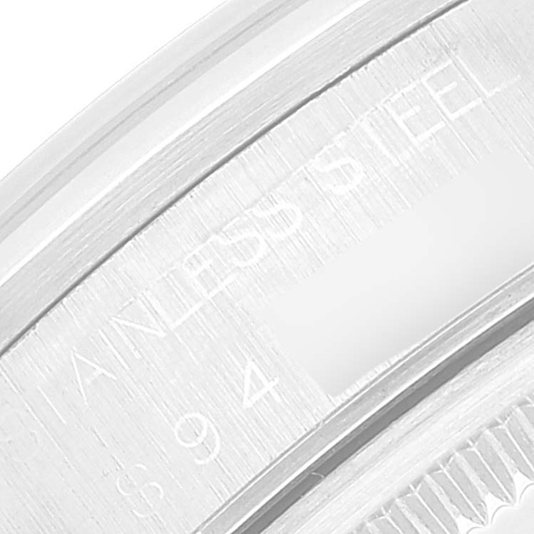 This macro shot shows the engraved markings on the stainless steel case back of a Rolex Air-King 14000 Men's Stainless Steel Silver Dial 14000 Men's Stainless Steel Silver Dial watch.