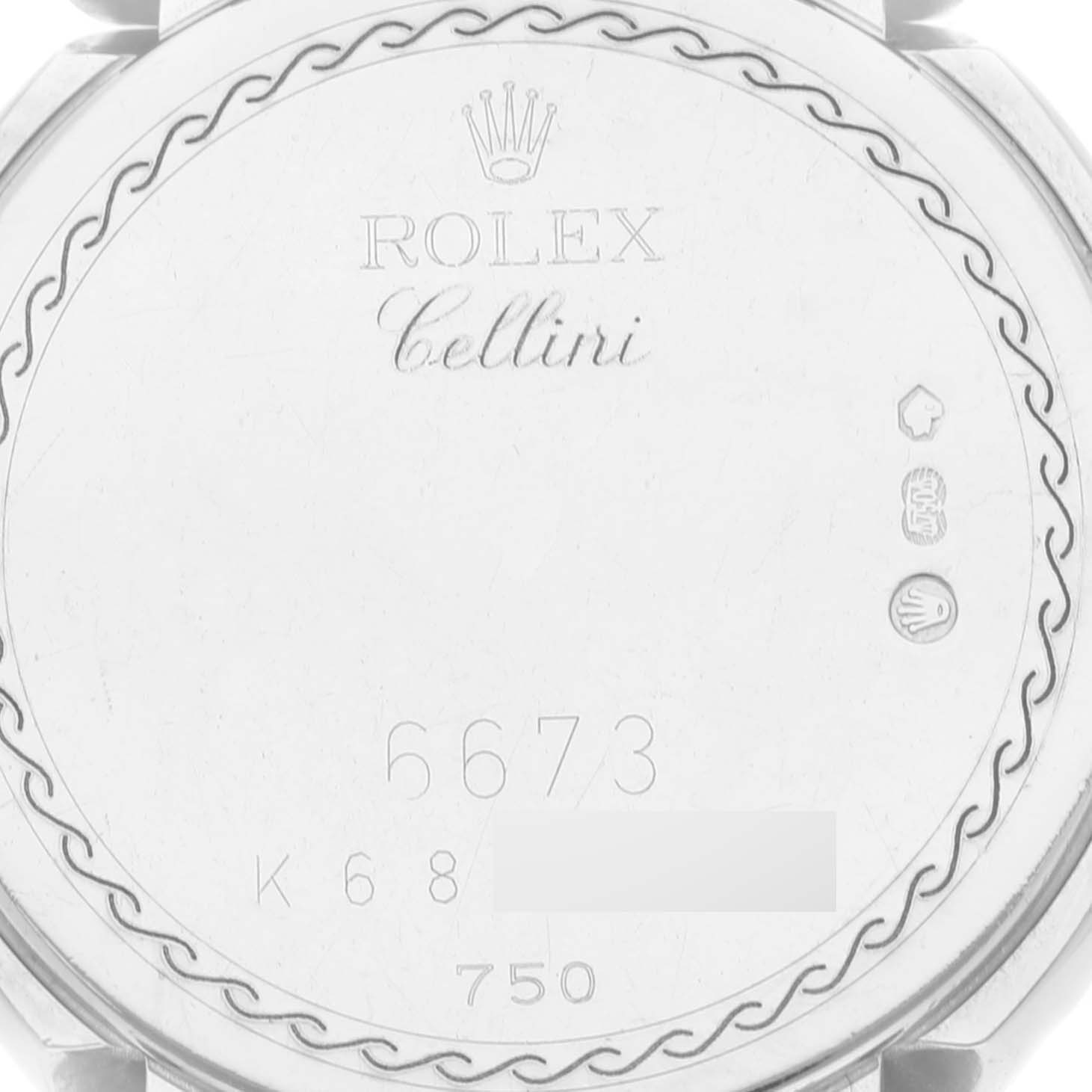 The image shows the back case of a Rolex Cellini 6673 Women
s White Gold Pink Dial 6673 Women
s White Gold Pink Dial watch, displaying the brand name, model, and various markings.