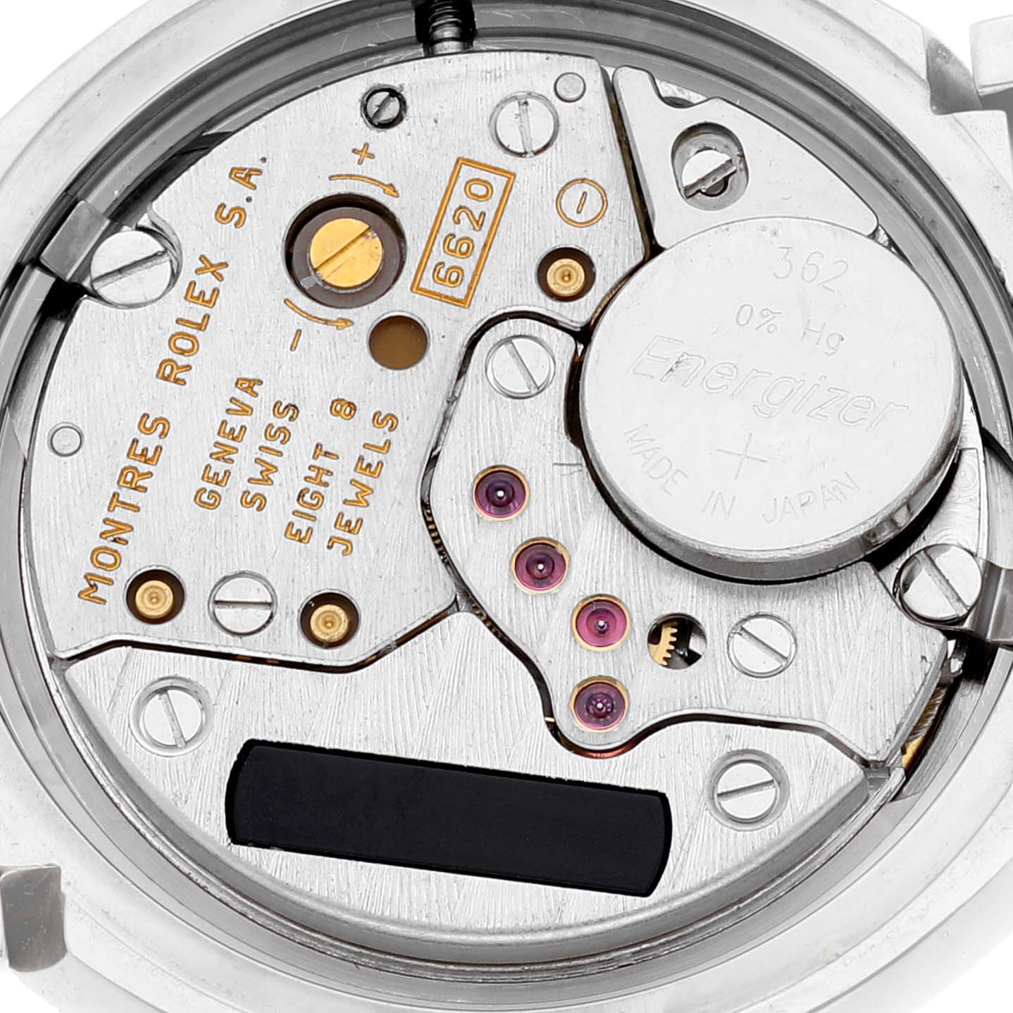 This image shows the internal movement of a Rolex Cellini 6673 Women
s White Gold Pink Dial 6673 Women
s White Gold Pink Dial watch, highlighting its mechanical components and battery.