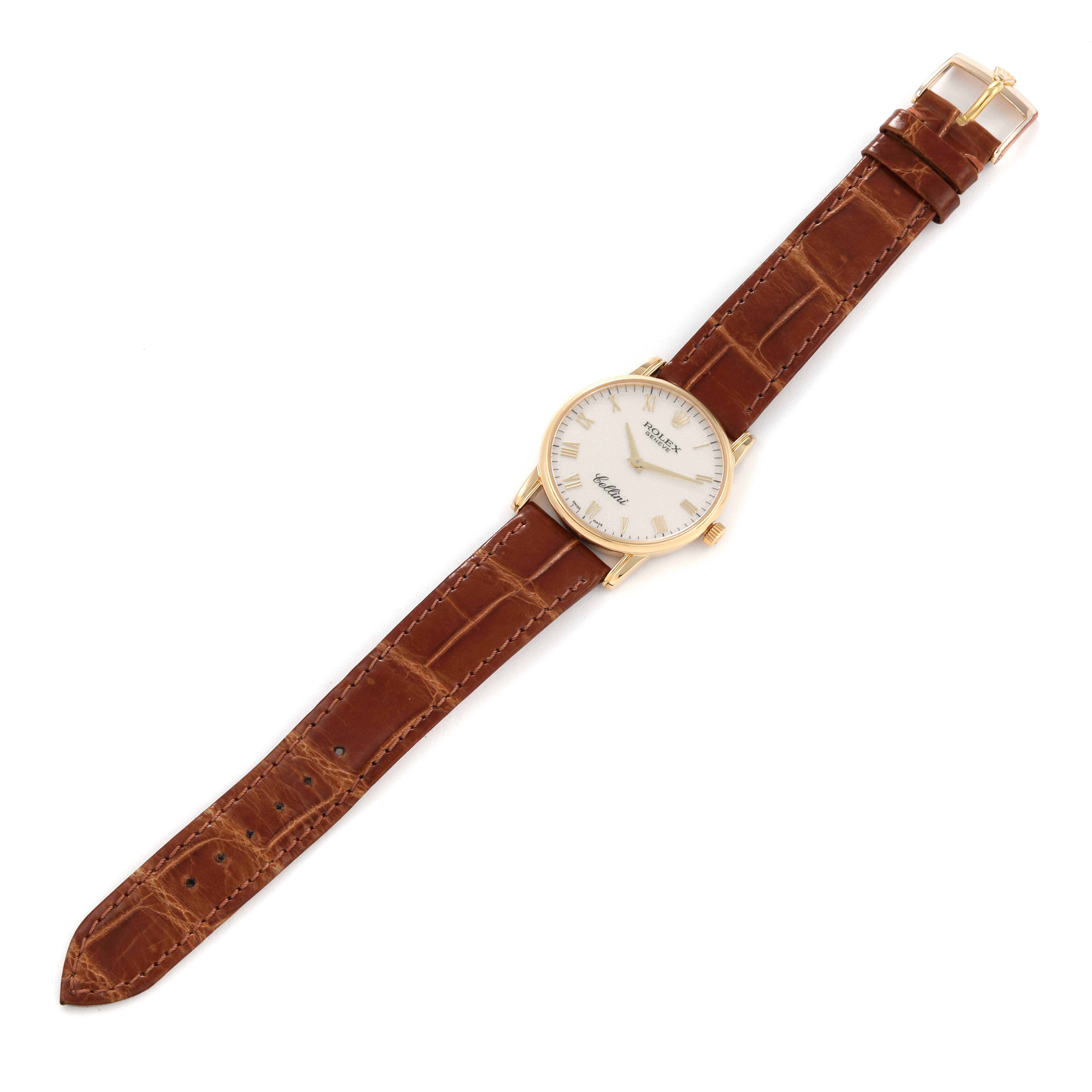 The image shows a Rolex Cellini 5116 Men's Yellow Gold White Dial 5116 Men's Yellow Gold White Dial watch with a brown leather strap, viewed from above.