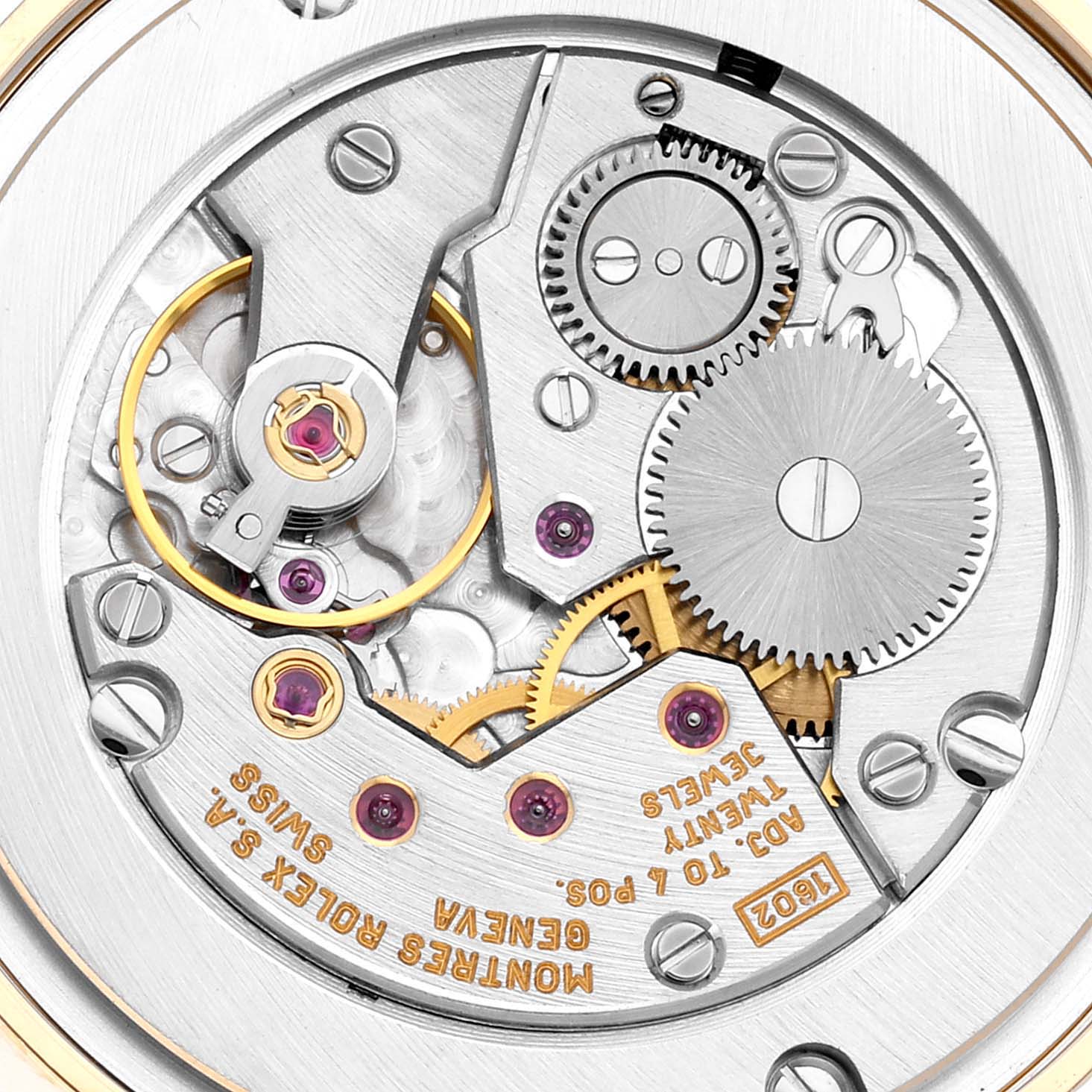 This is a close-up view of the mechanical movement of a Rolex Cellini 5116 Men's Yellow Gold White Dial 5116 Men's Yellow Gold White Dial watch, showcasing its intricate gears and components.