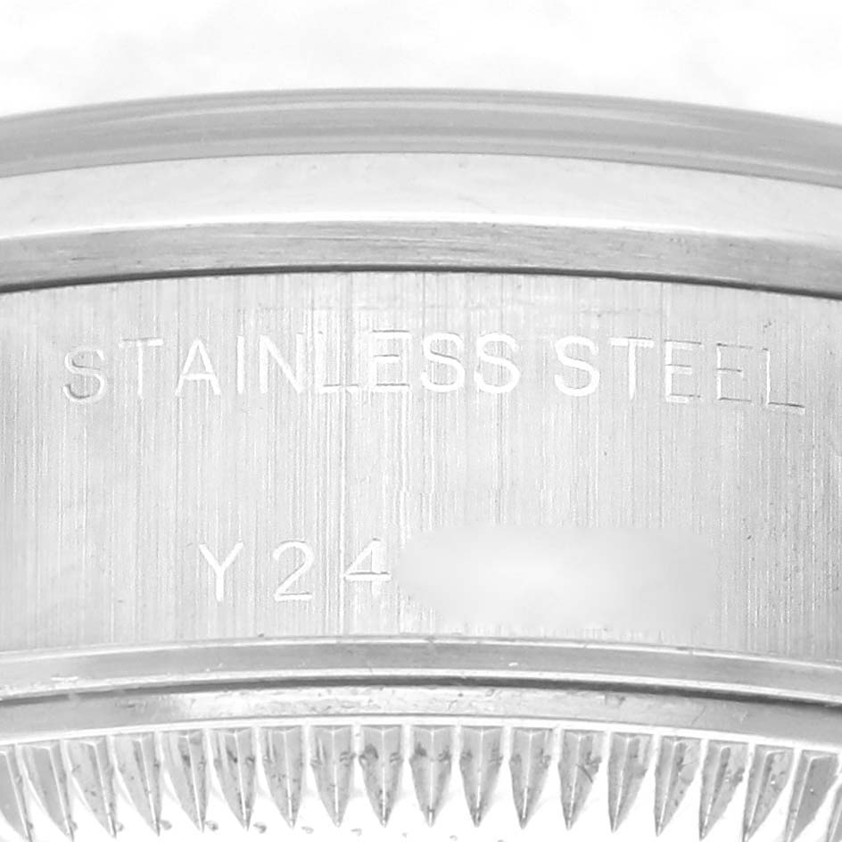 The image shows the side view of a Rolex Date 79160 Women's Stainless Steel Blue Dial 79160 Women's Stainless Steel Blue Dial model, highlighting the "STAINLESS STEEL" engraving on the case.