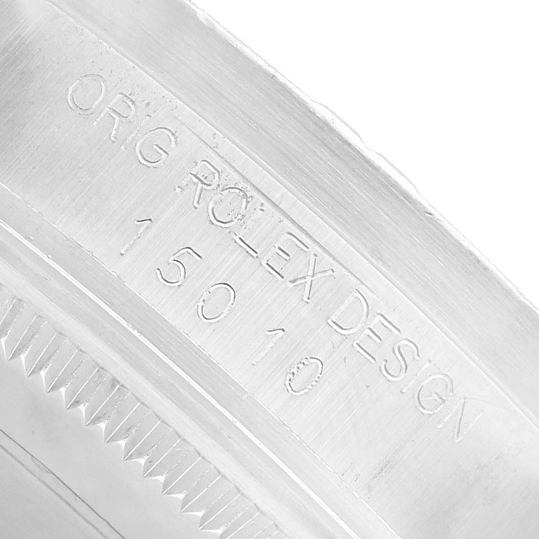 The image shows the engraved inner rim of a Rolex Date 15010 Men's Stainless Steel Silver Dial model, featuring the design number.