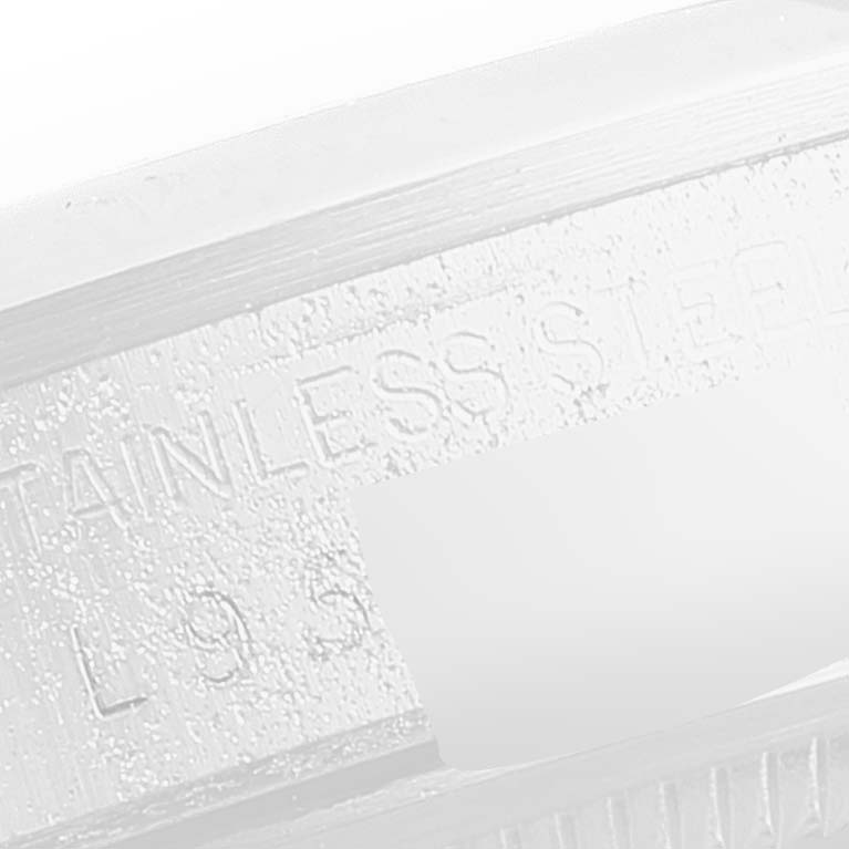 This image shows a close-up of the text "STAINLESS STEEL" on the case back of a Rolex Date 15200 Men's Stainless Steel Silver Dial 15200 Men's Stainless Steel Silver Dial model watch.