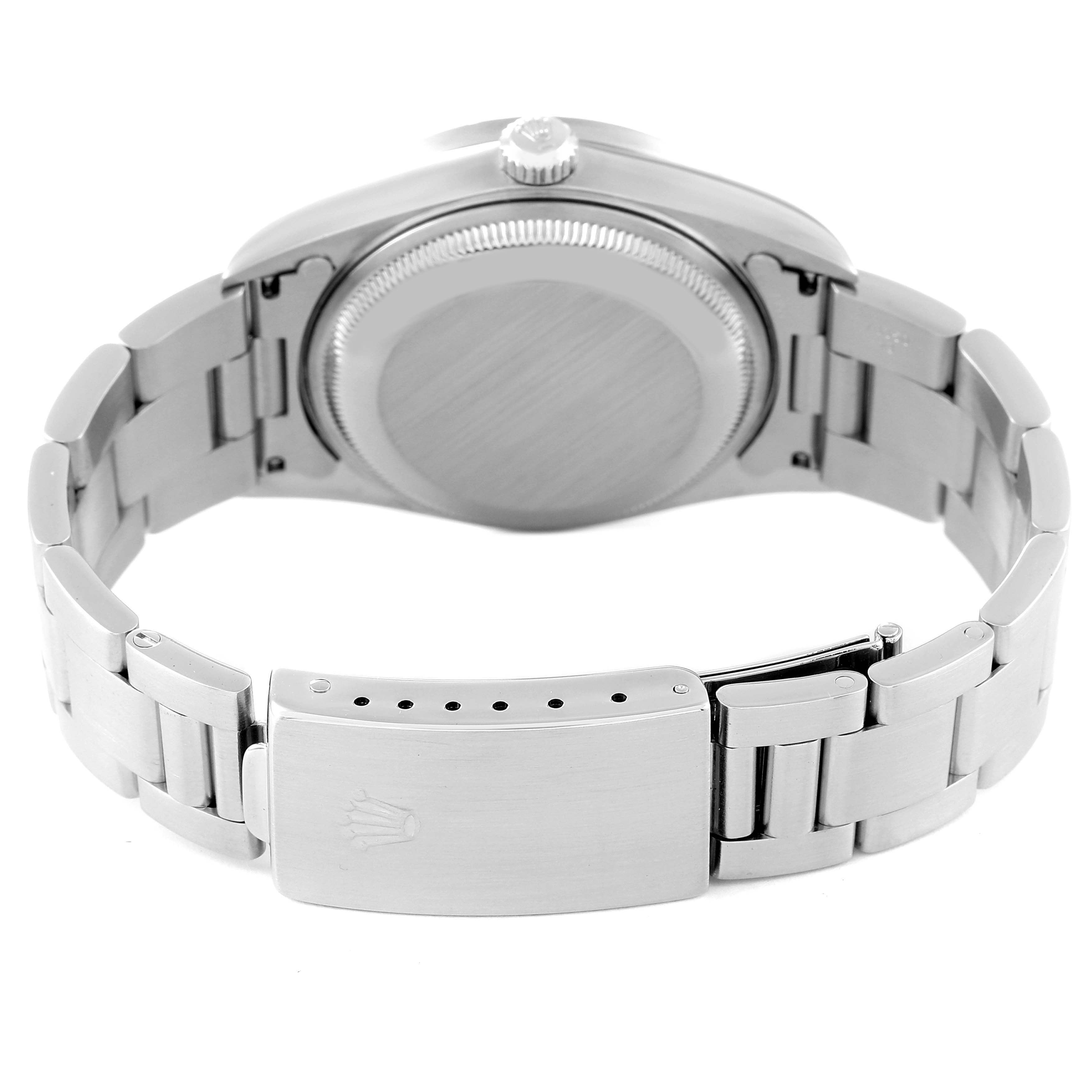 The image shows the back view of a Rolex Date 15210 Men
s Stainless Steel Silver Dial 15210 Men
s Stainless Steel Silver Dial watch, including the case back and the clasp of the metal bracelet.