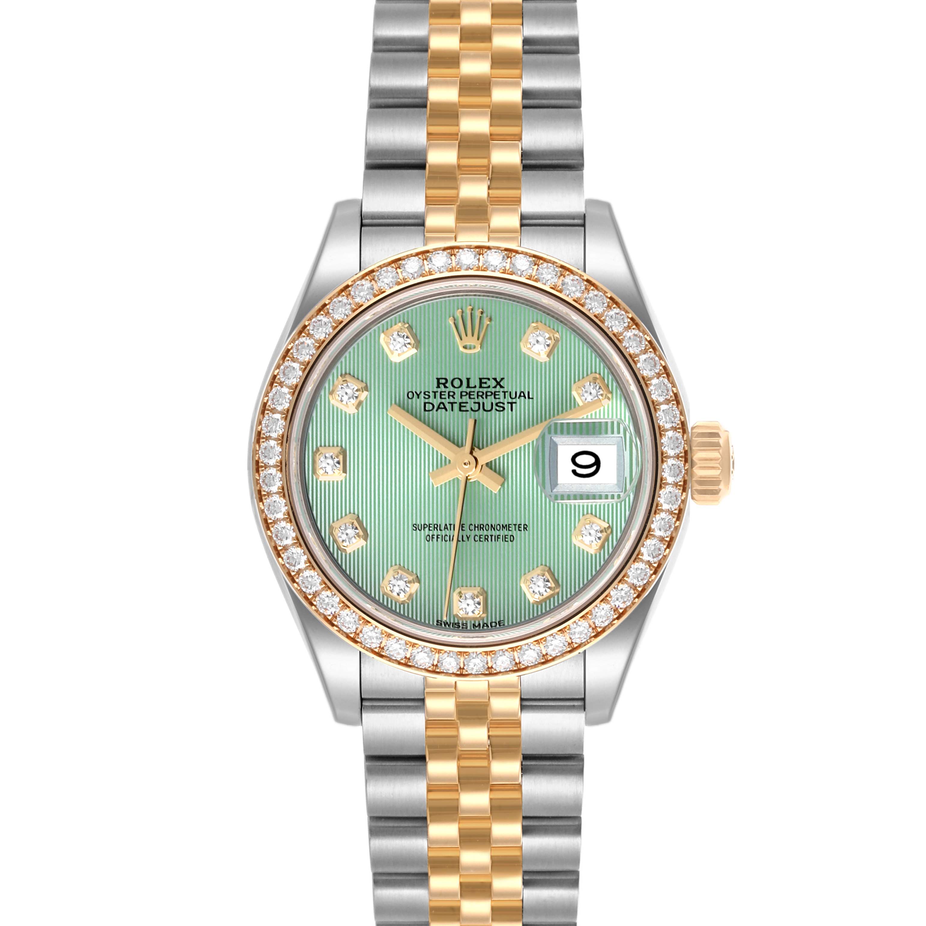 The Rolex Mid-Size watch is shown here from the front, featuring a green dial, diamond bezel, and two-tone bracelet.