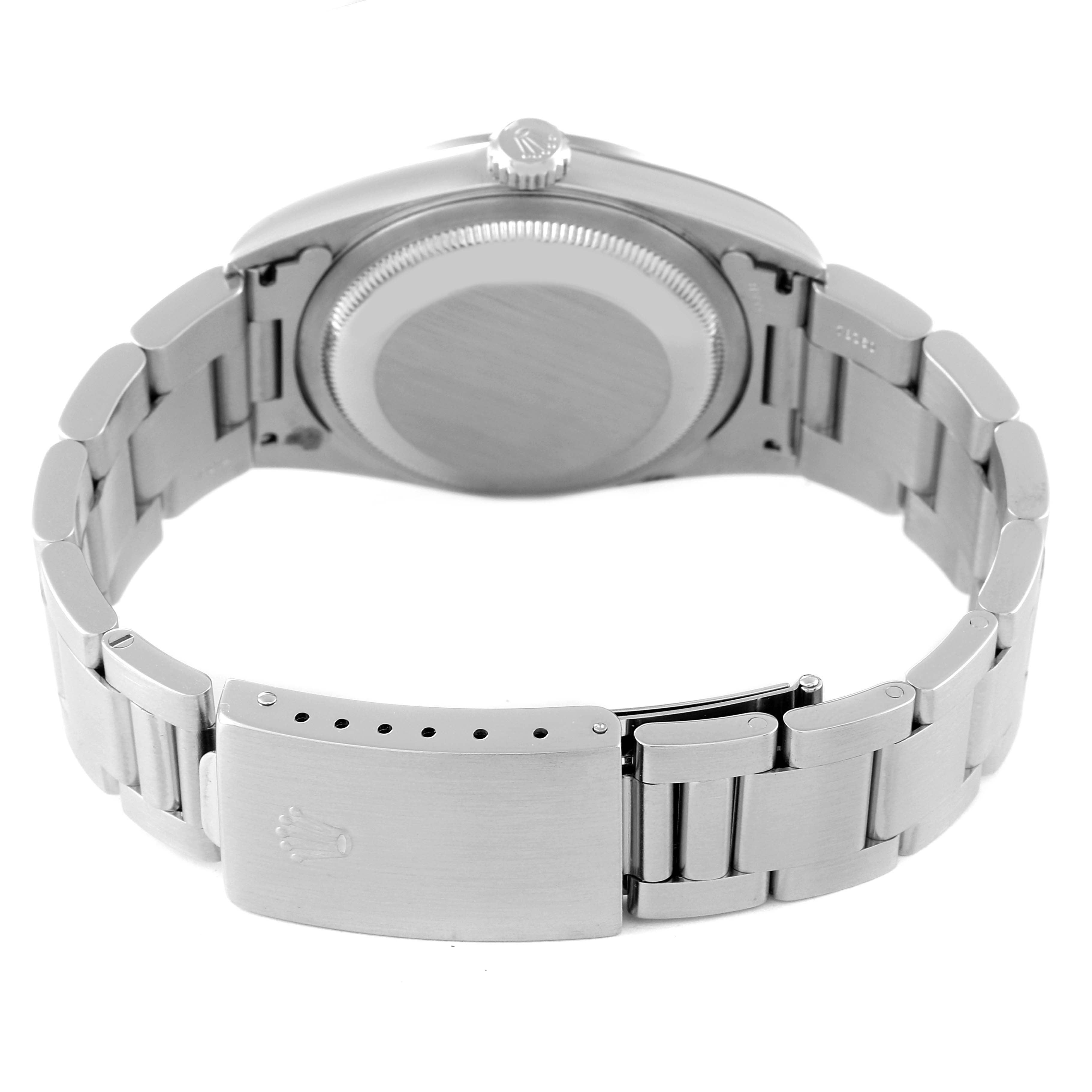 This image shows the back view of a Rolex Datejust 16200 Men's Stainless Steel Blue Dial 16200 Men's Stainless Steel Blue Dial watch, highlighting its case back and metal bracelet with a clasp.